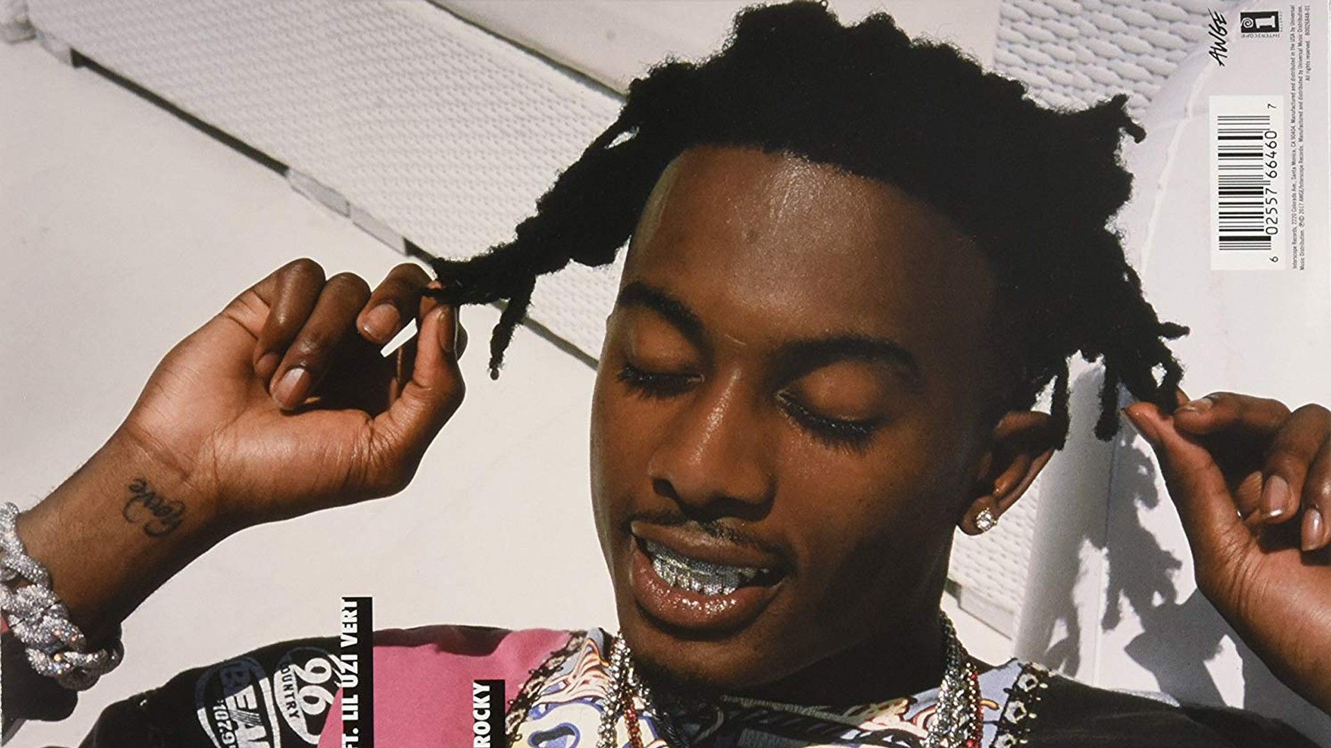 playboi carti is closing eyes and touching hair with fingers in white background HD music Wallpaper