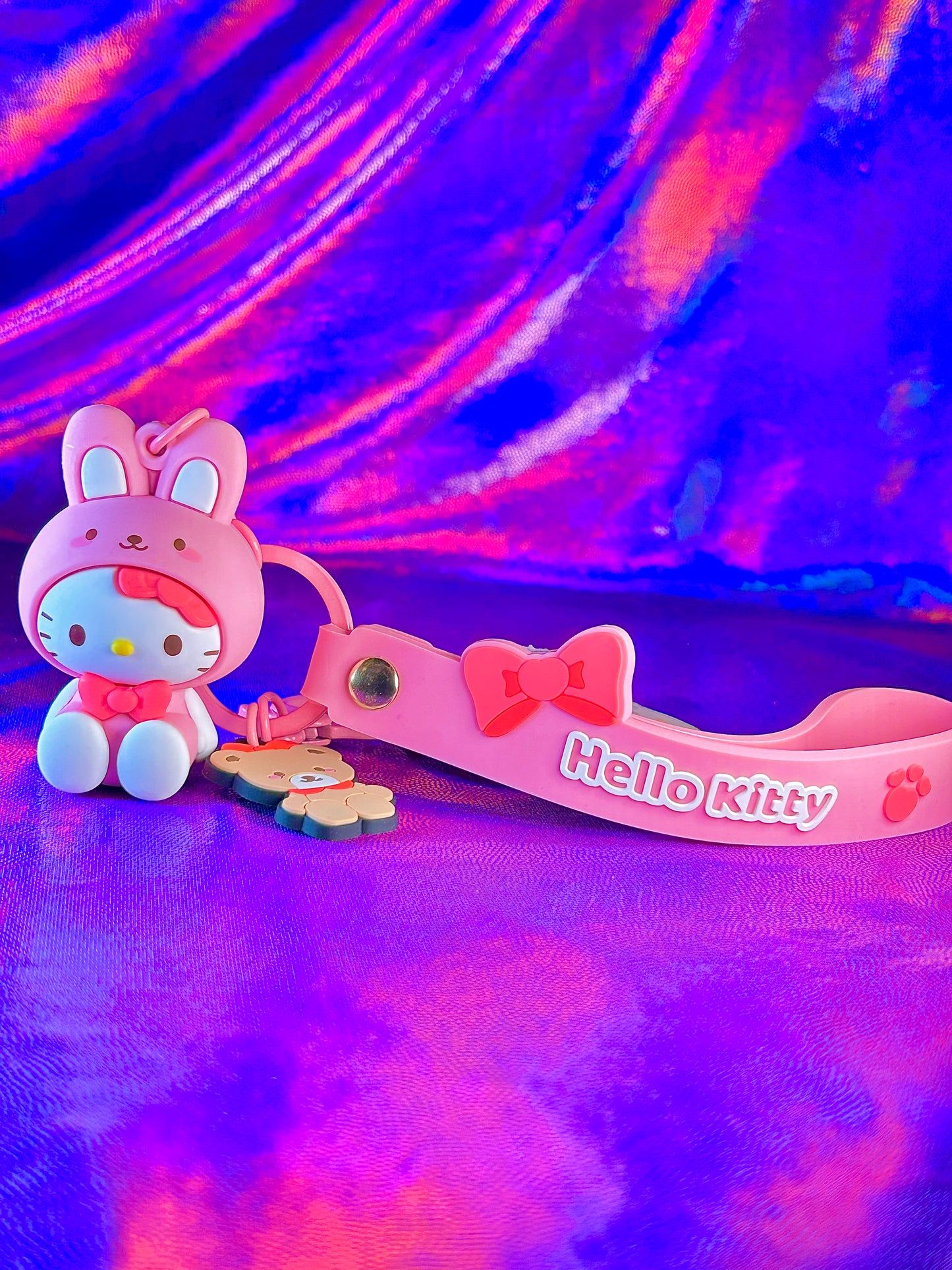 A hello kitty toy and a hello kitty keychain - Sanrio