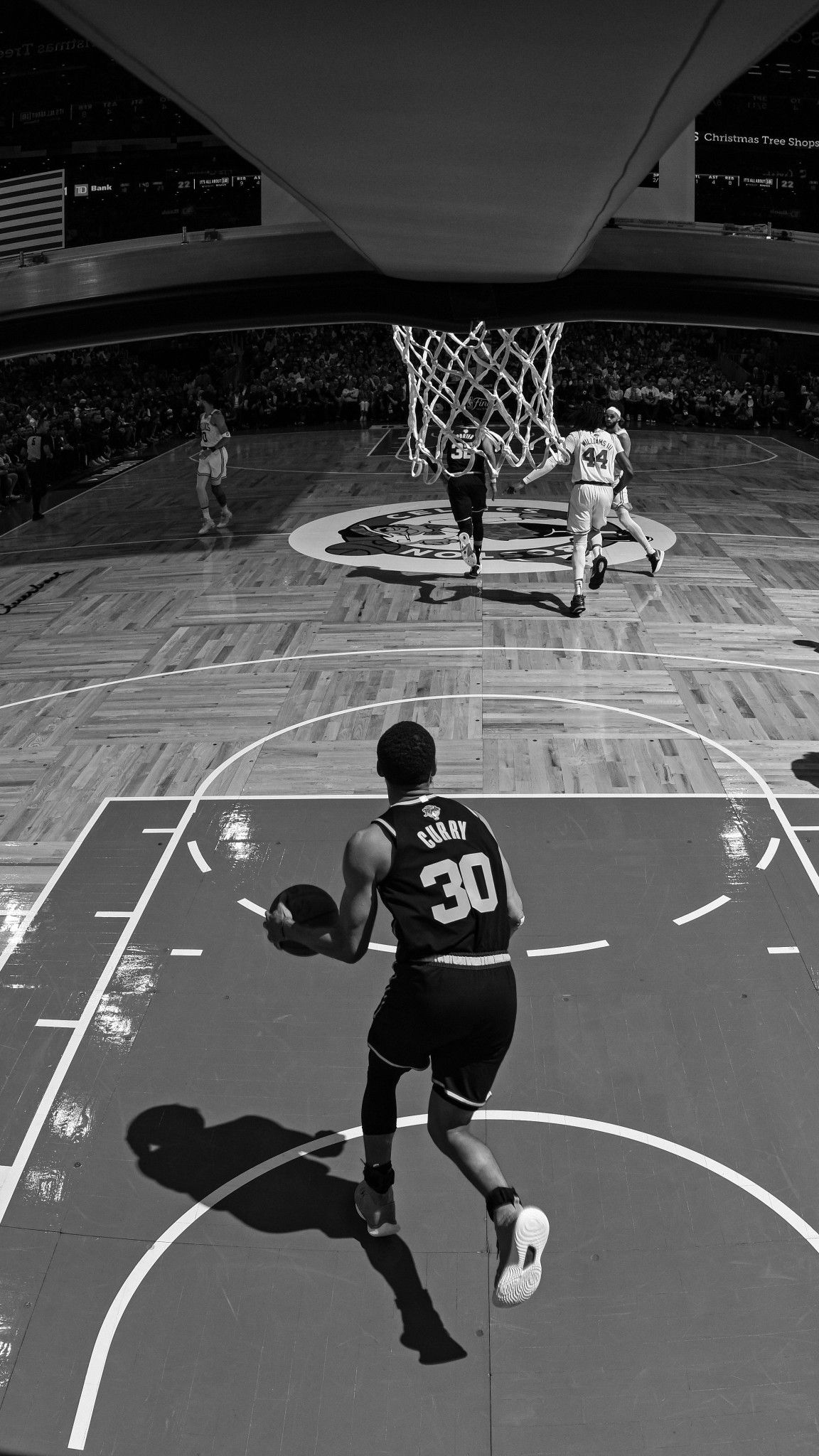 Black and white photo of a basketball player on the court - NBA