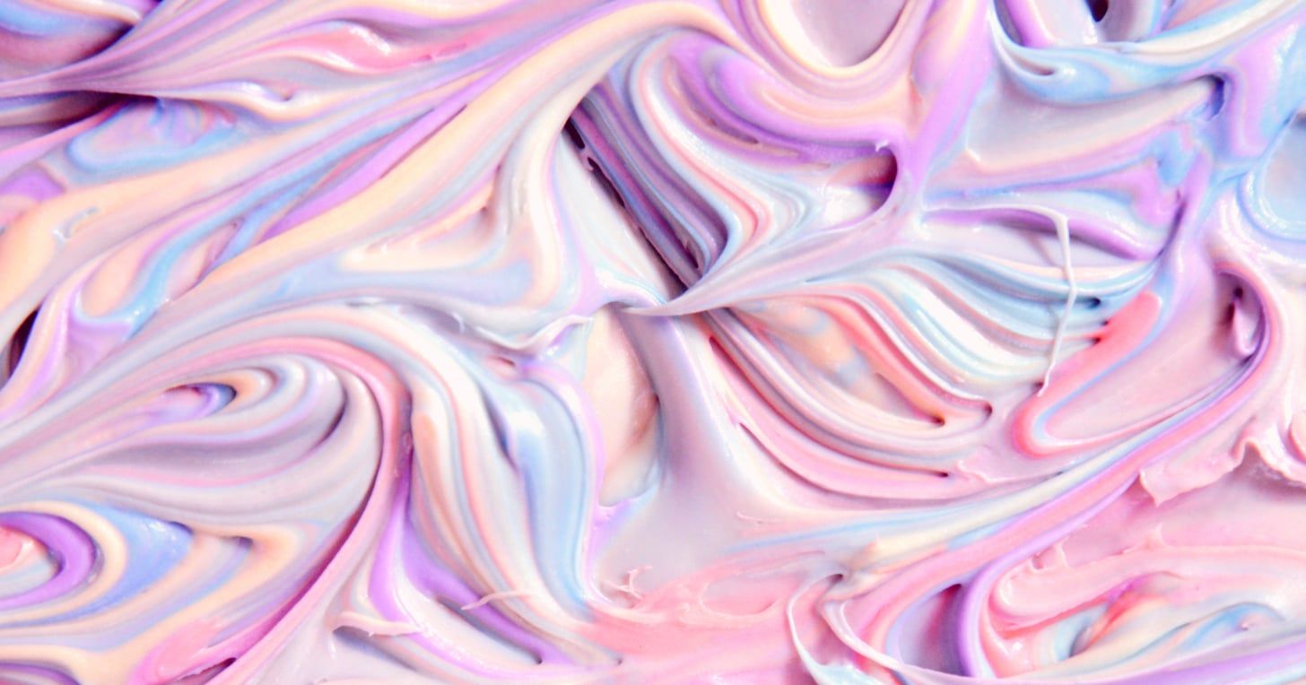 Swirled icing in pink, purple, and blue. - Marble