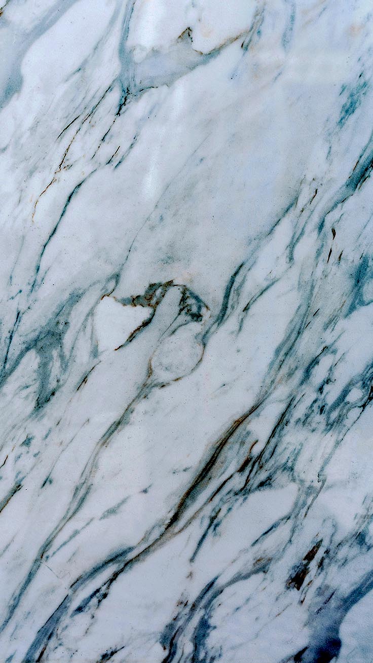 A close up of a marble surface with blue and white colors. - Marble