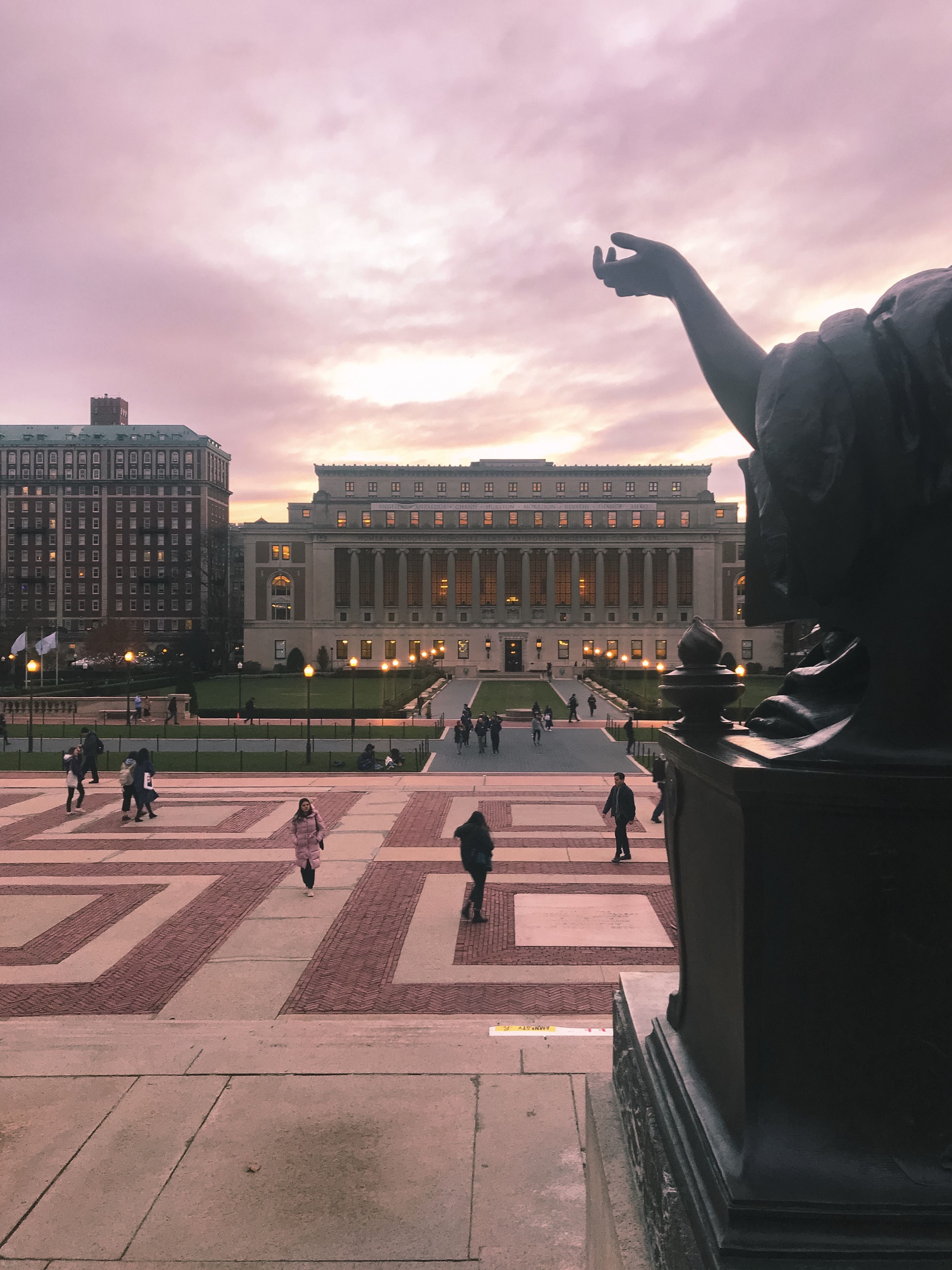 A view of the steps of Columbia University at sunset. - Columbia University