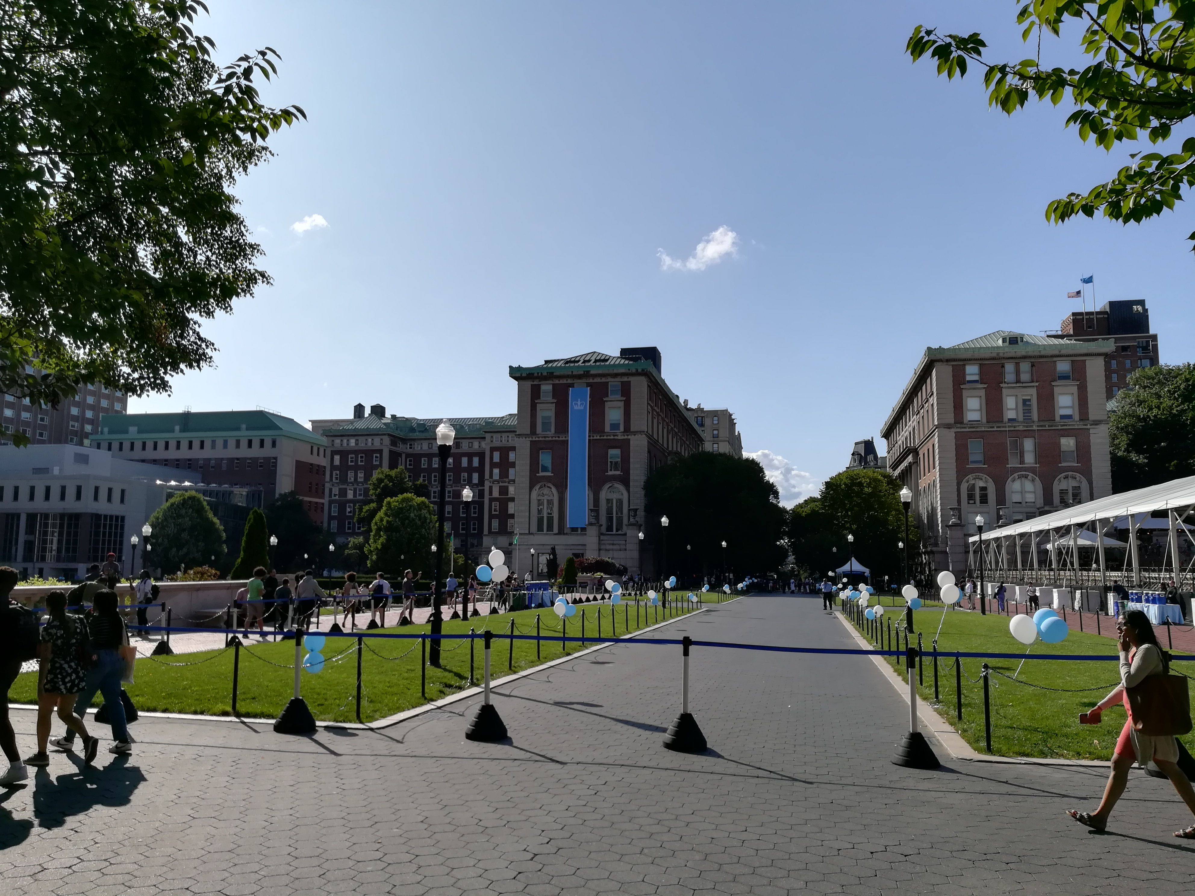 A view of a large building with a blue banner on it - Columbia University