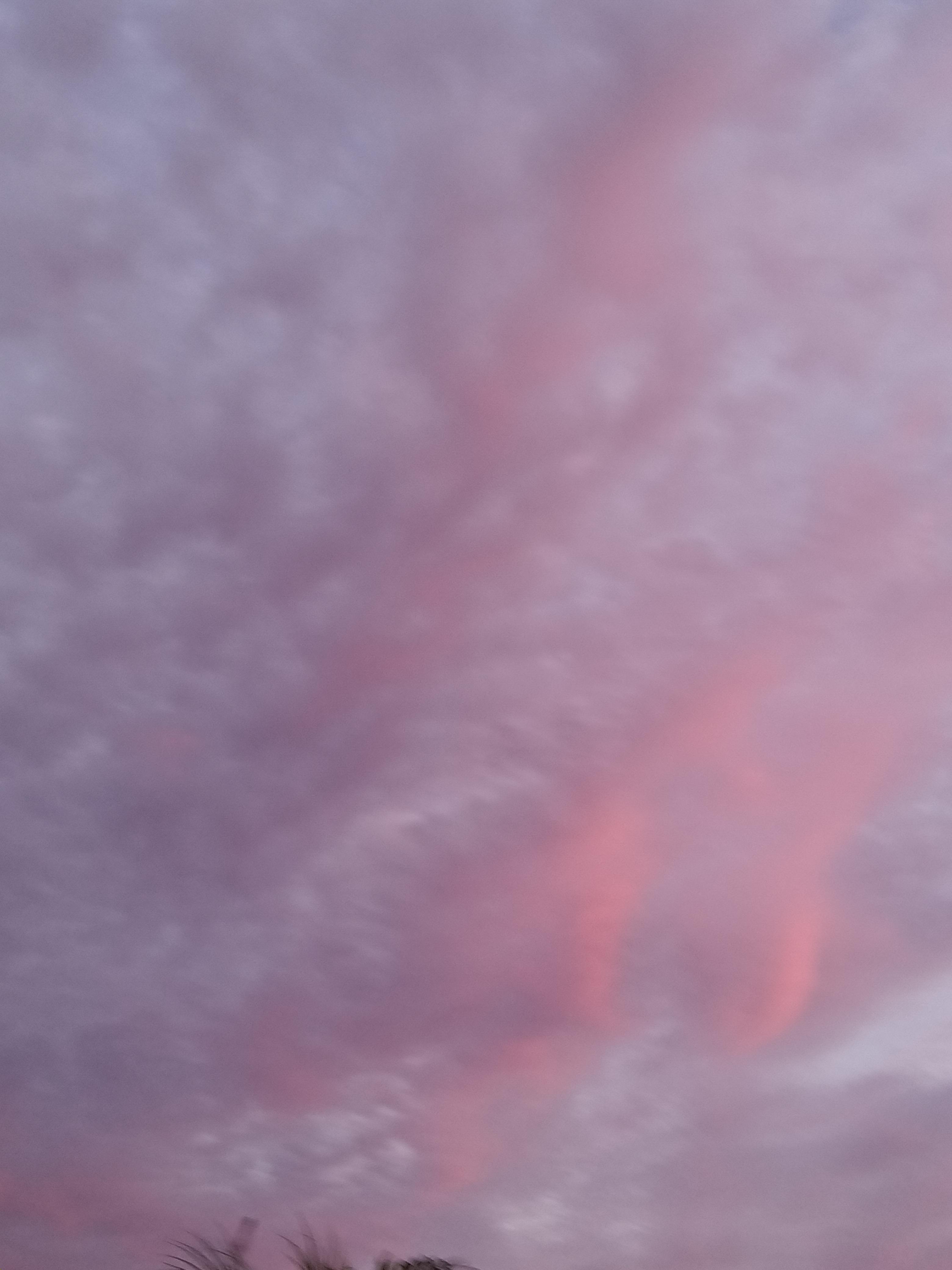 A pink and purple sky with clouds. - Cloud