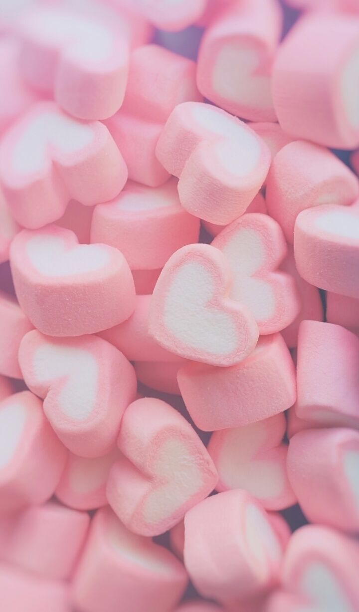 A pile of pink and white heart shaped marshmallows. - Marshmallows