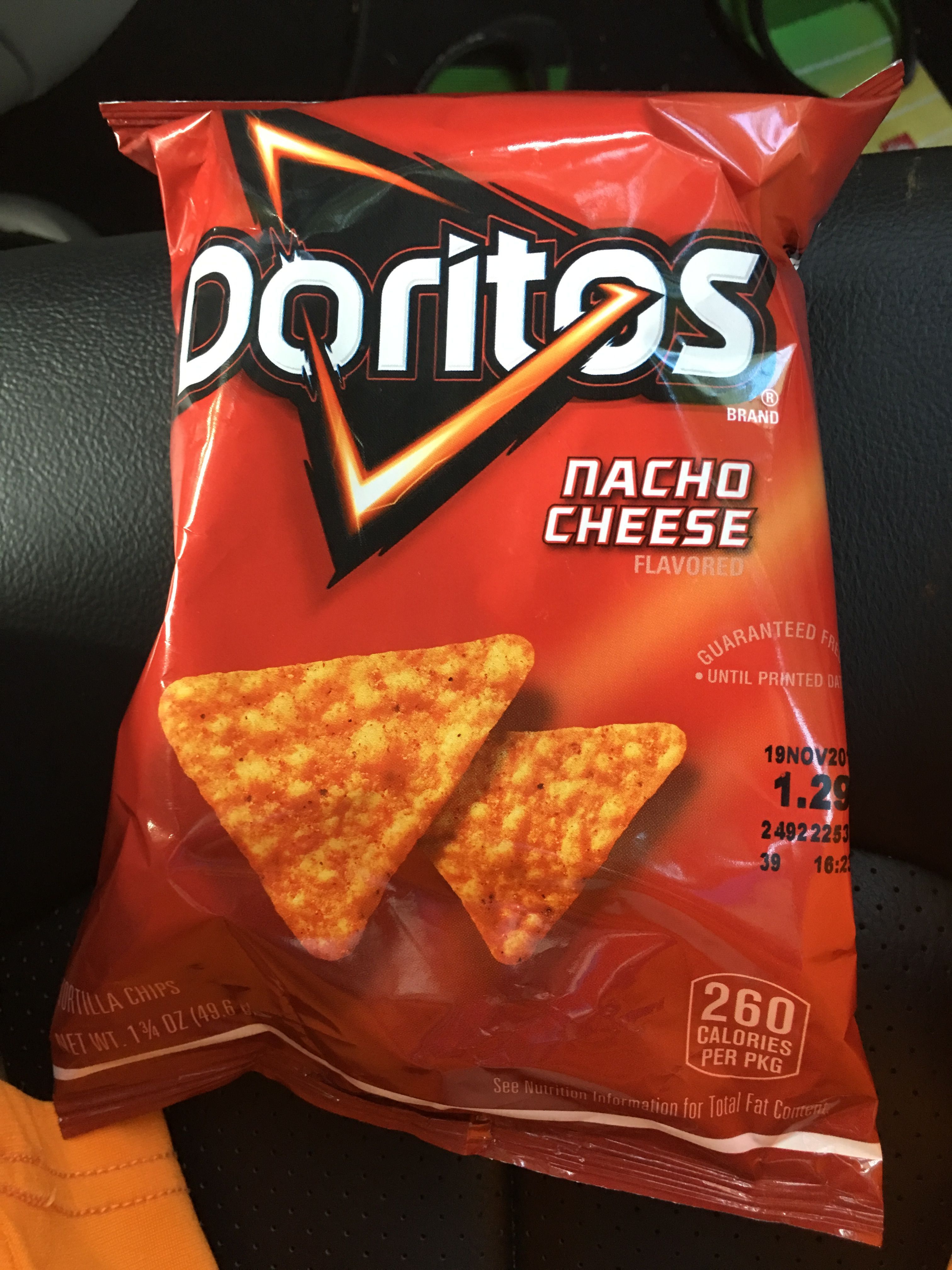 A bag of Doritos Nacho Cheese flavored chips. - Doritos