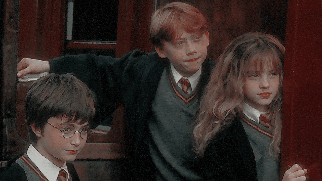 A group of children standing in front - Harry Potter