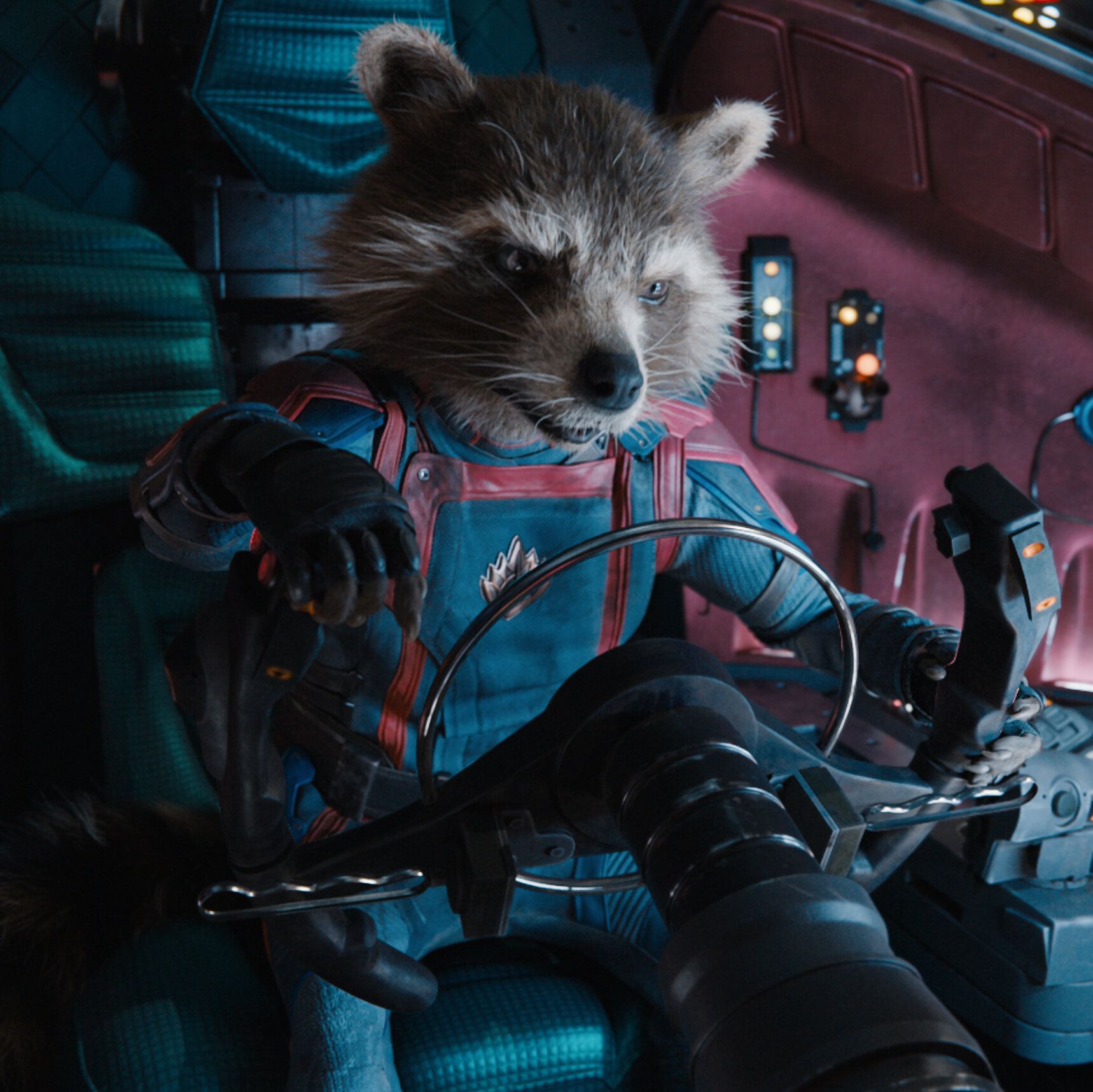Rocket Raccoon, voiced by Bradley Cooper, sits in the cockpit of the Guardians of the Galaxy ship in Guardians of the Galaxy Vol. 2. - Guardians of the Galaxy
