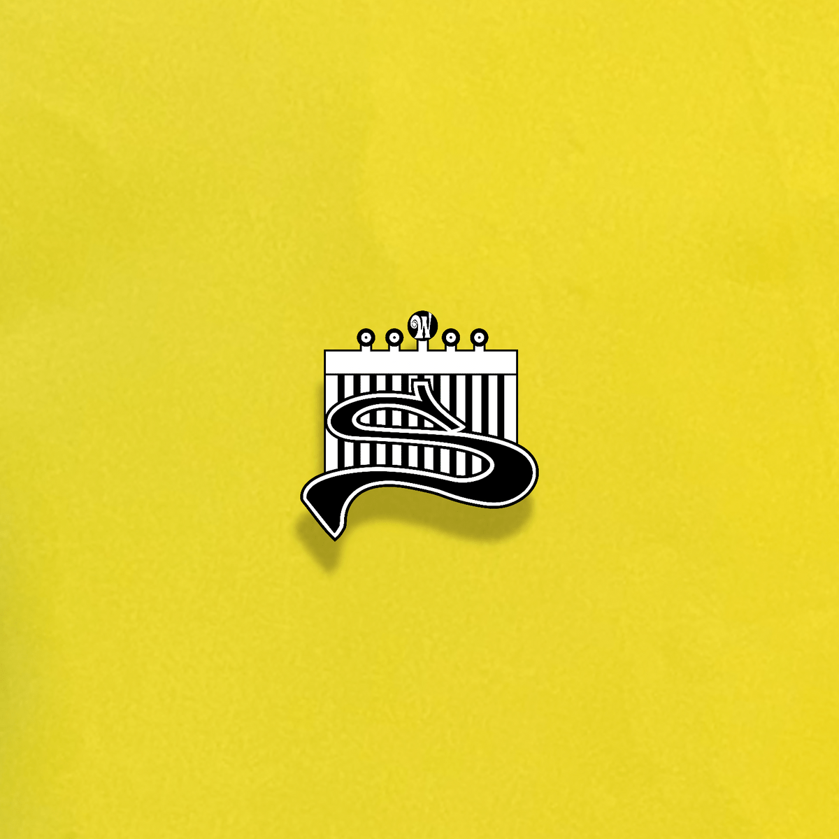 A yellow and black enamel pin with a wave design - Hufflepuff