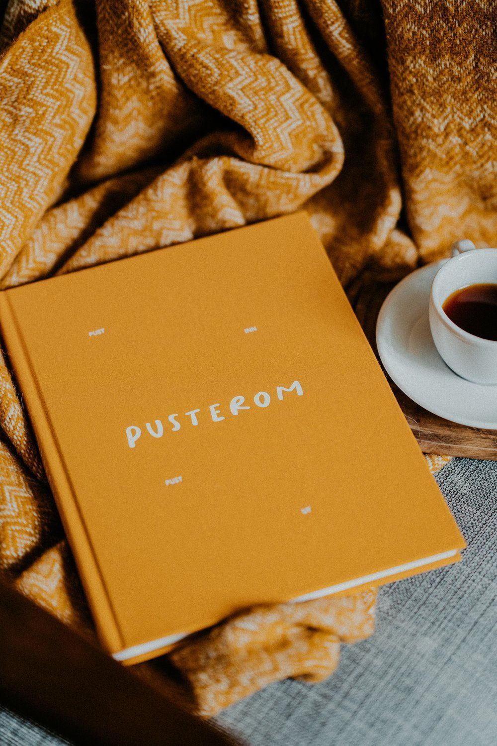 A yellow book with the word Pusterom on it. - Hufflepuff