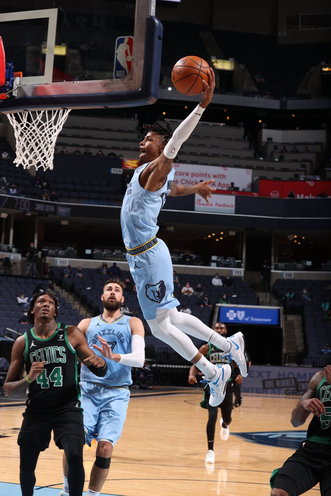 Ja Morant of the Memphis Grizzlies goes up for a dunk against the Boston Celtics during the second half at FedExForum on April 15, 2021 in Memphis, Tennessee. - Ja Morant