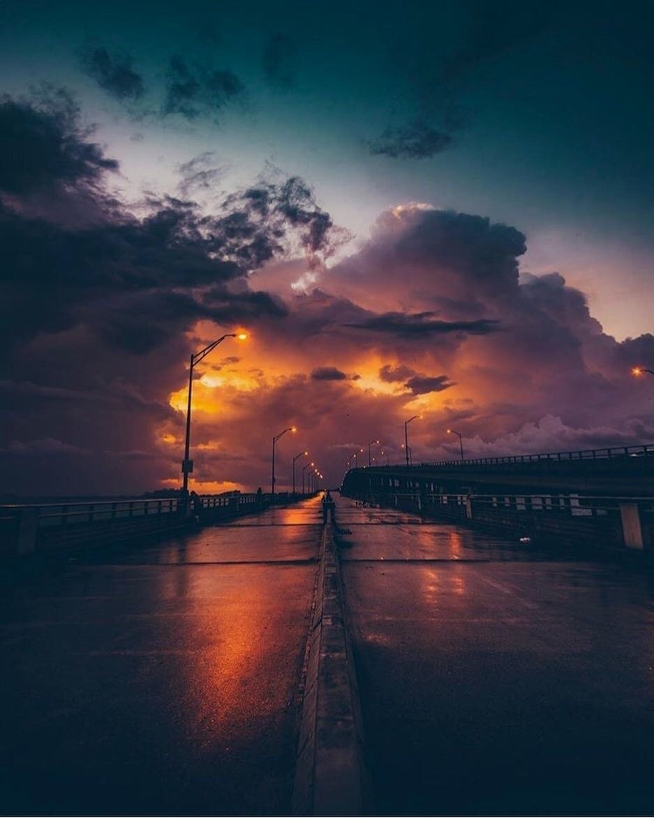 A long road with lights leading to the sky - Florida