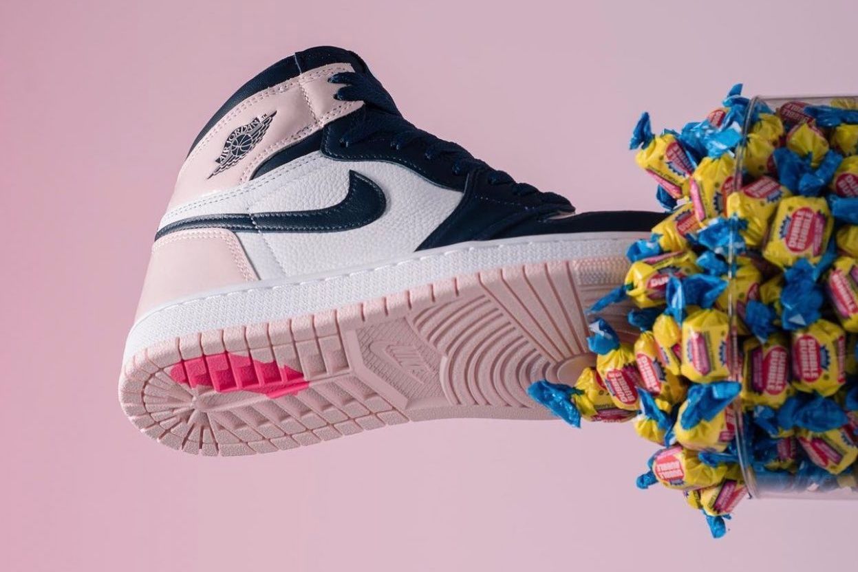 A pair of sneakers on top with candy - Air Jordan 1