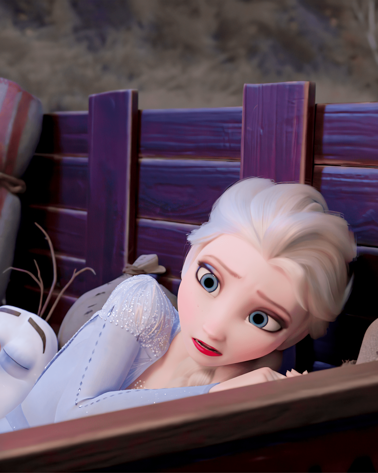 A cartoon character is laying in the bed - Elsa