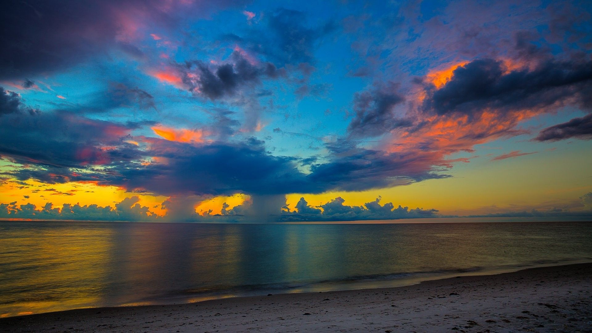 A sunset over the ocean with clouds - Florida