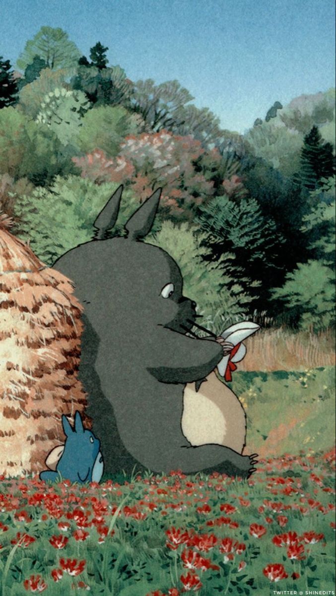 A cartoon of an animal sitting in the grass - My Neighbor Totoro