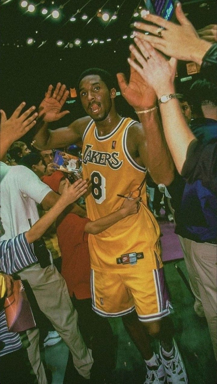 Kobe Bryant greets fans after a game in 1998. - Kobe Bryant