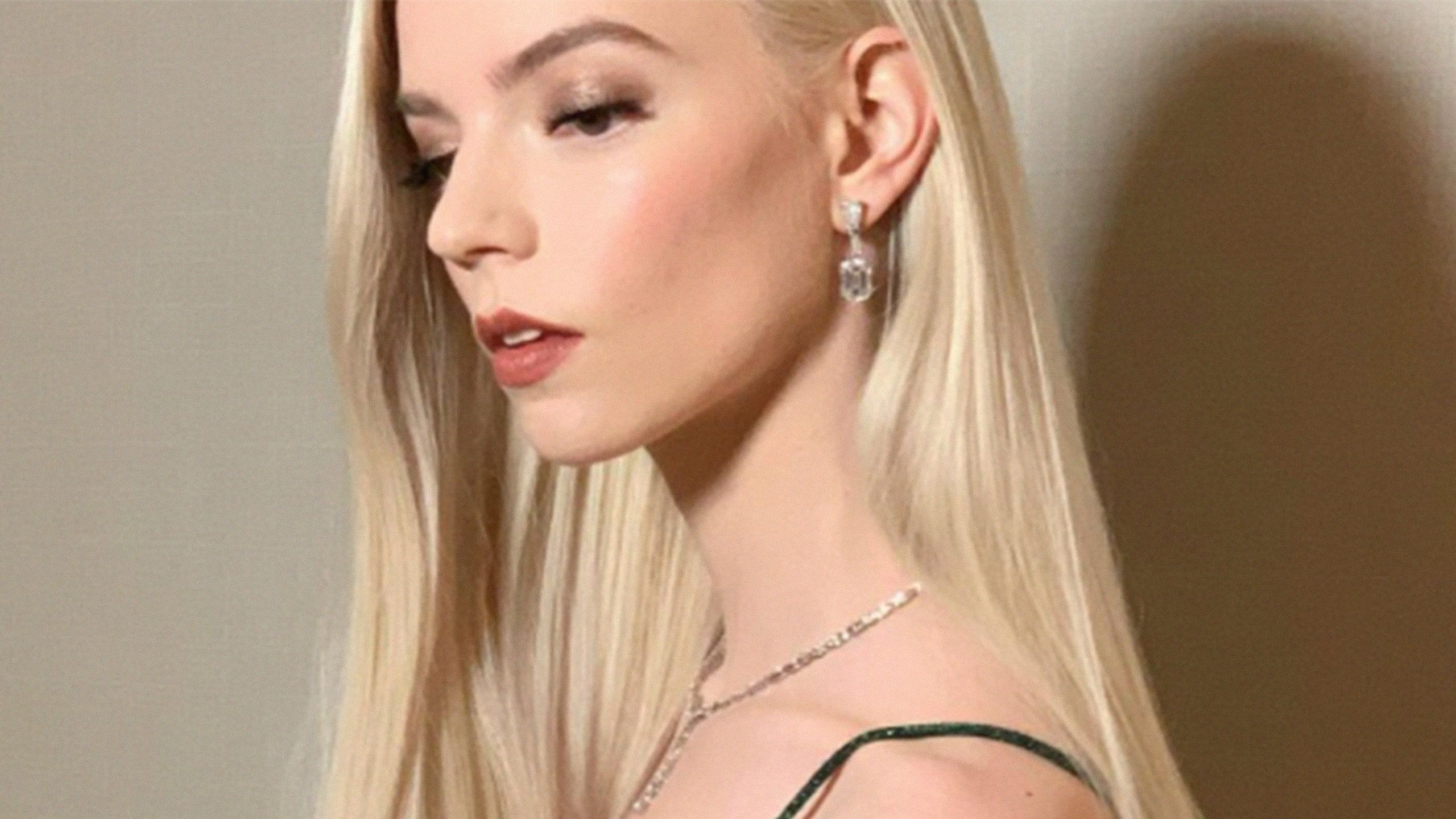 Dove cameron with long blonde hair and silver drop earrings - Anya Taylor-Joy