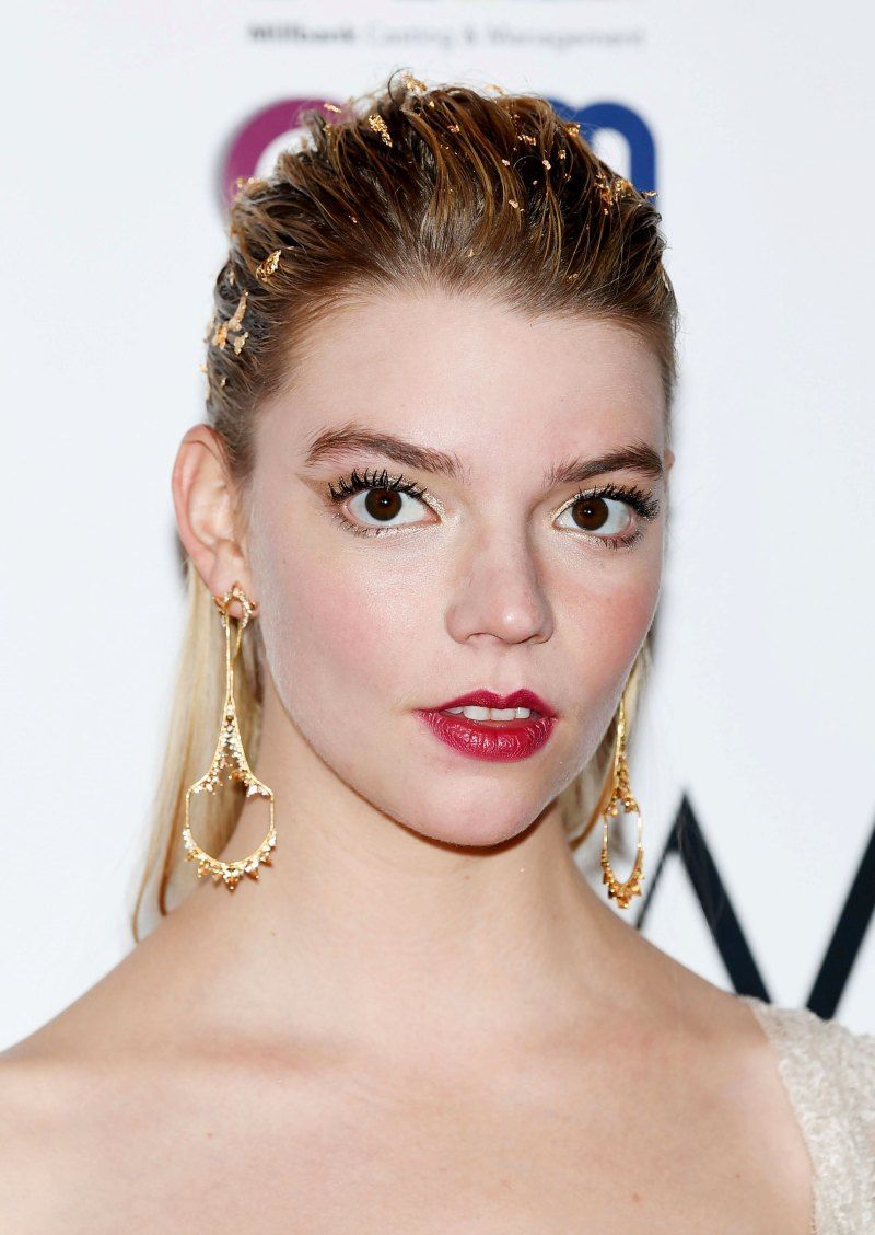 A woman with long hair and earrings - Anya Taylor-Joy