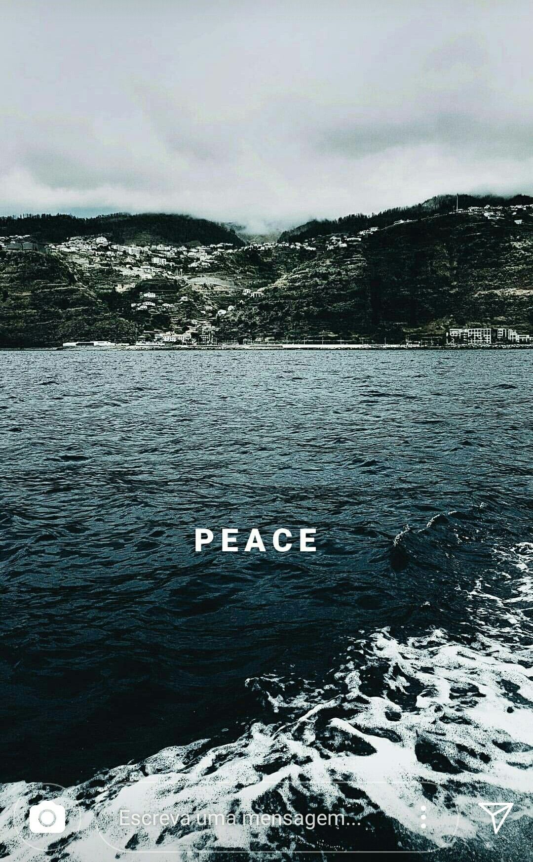 A picture of the ocean with the word peace written in the middle - Peace