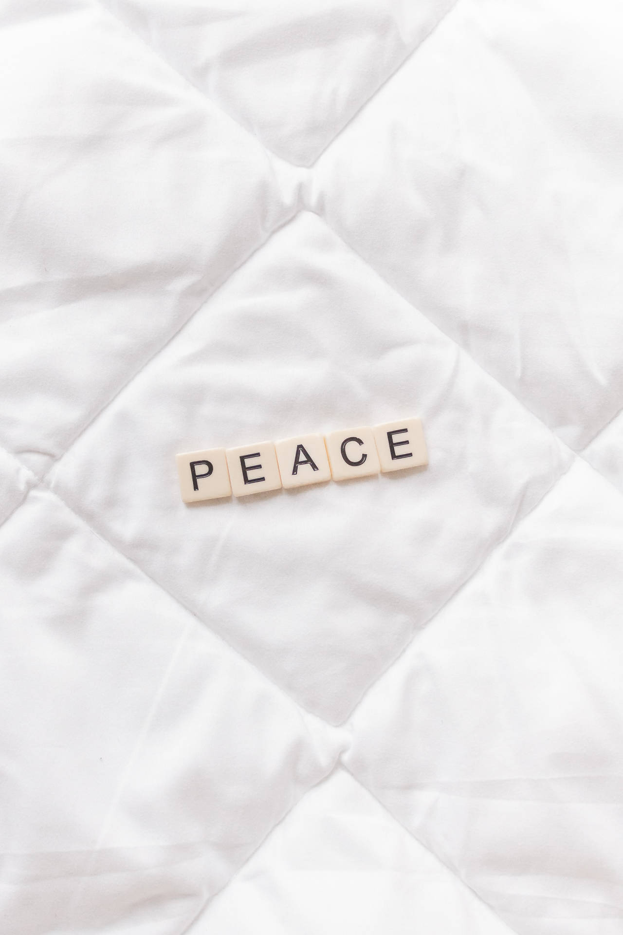 A close up of the word peace on top - Peace