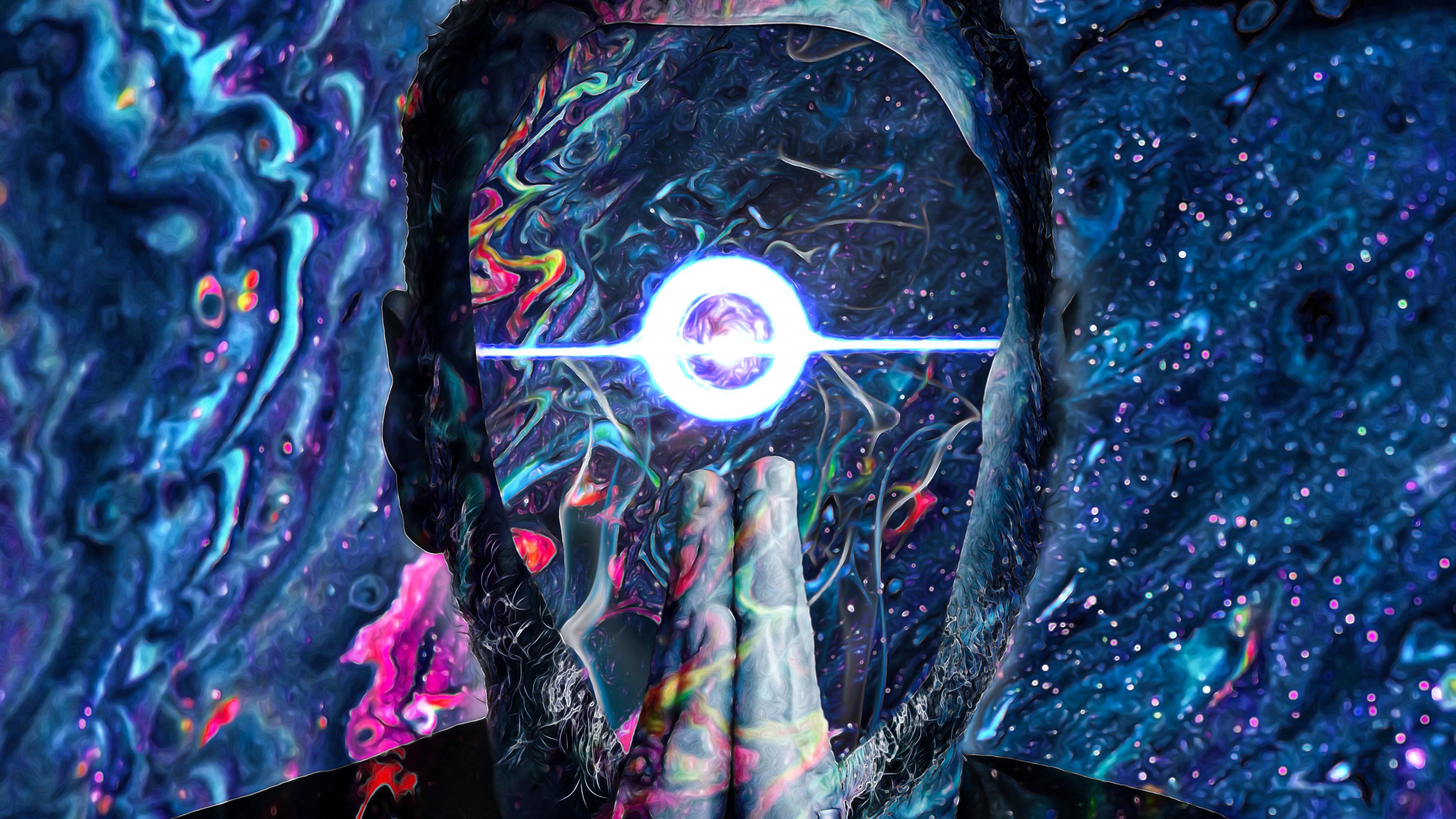 A man with his hands in a praying position in front of his face, with a swirling galaxy background - Peace