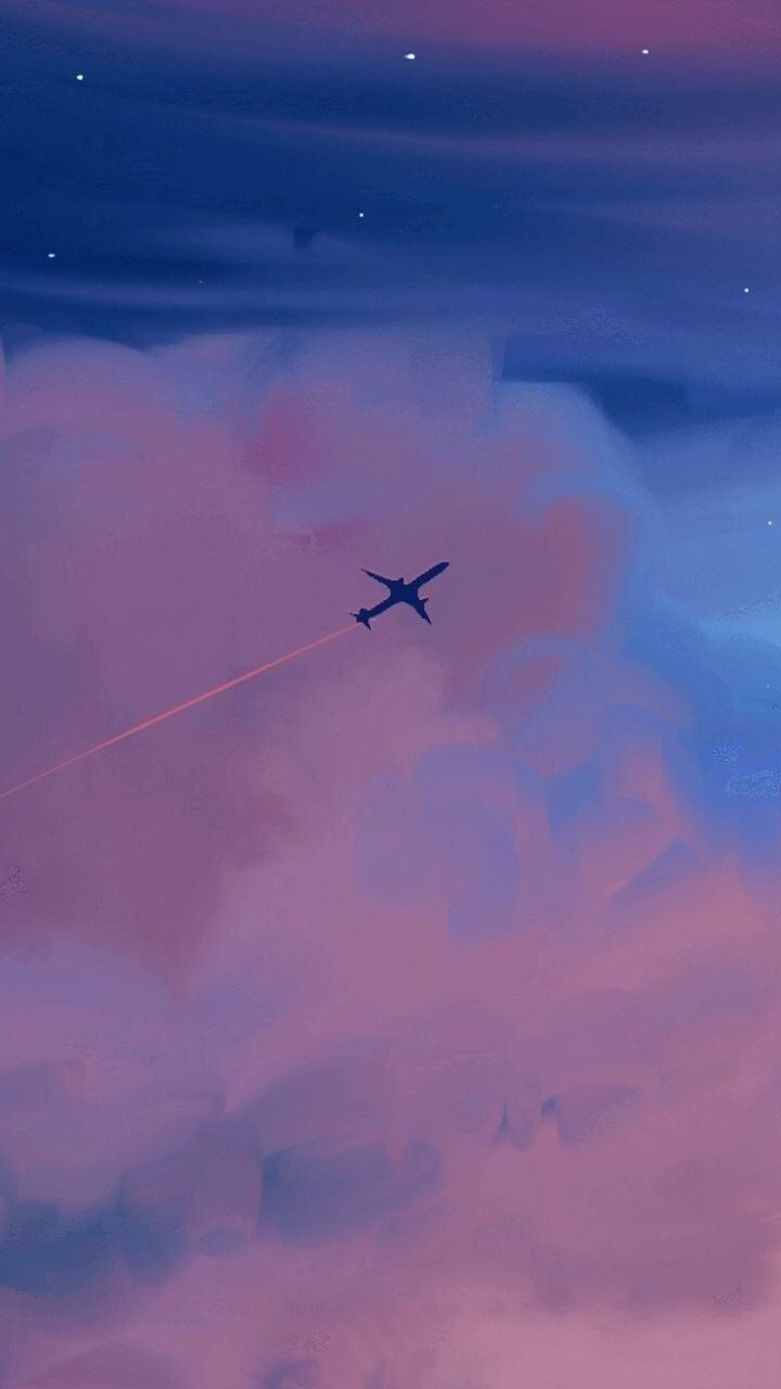 A plane flying through the clouds at sunset - Airplane