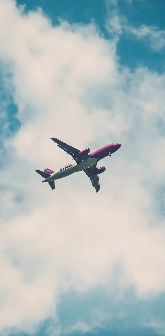 A large airplane flying through the sky - Airplane