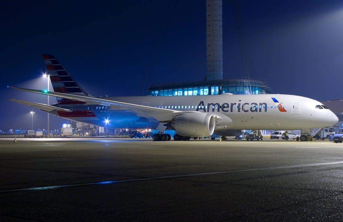 A large airplane sitting on the runway - Airplane