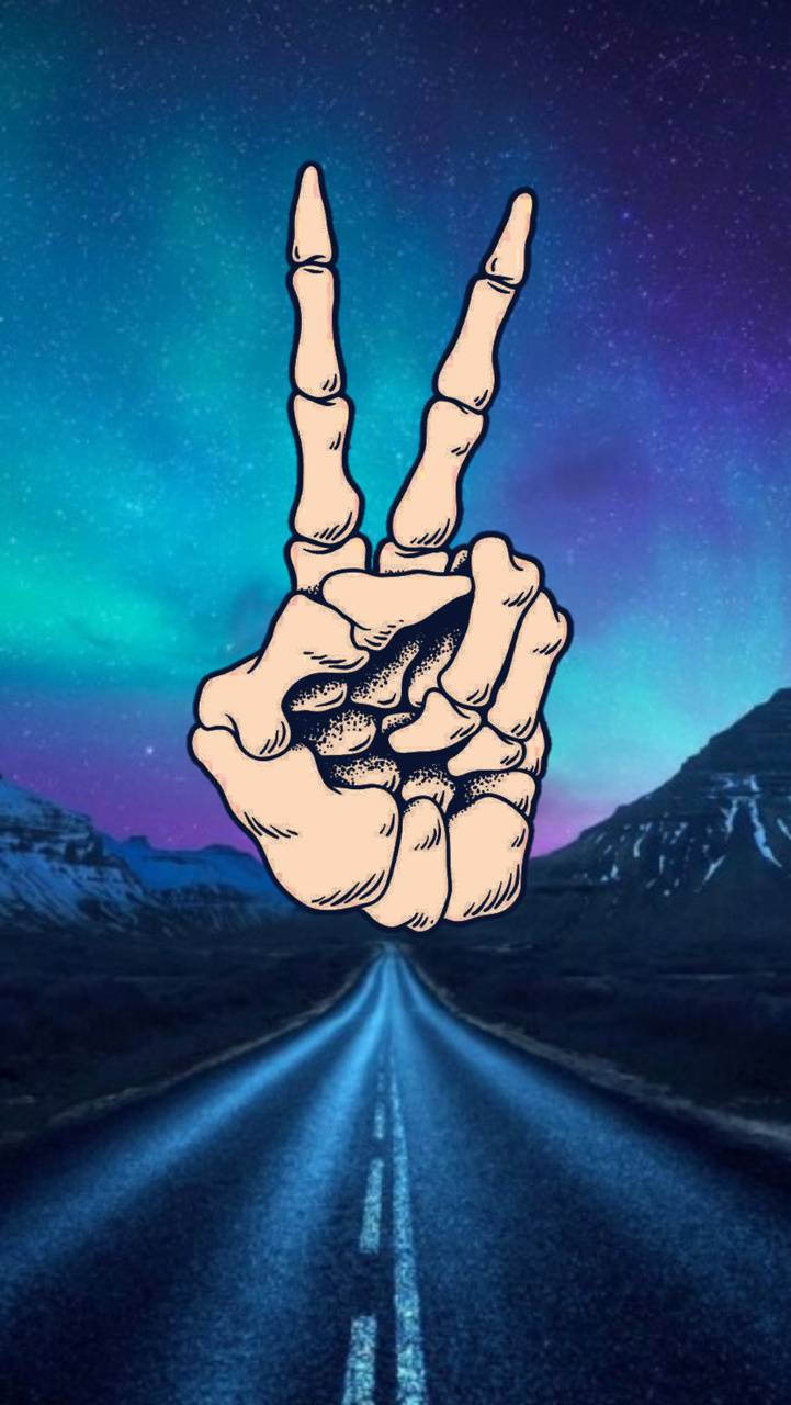 Skeleton hand giving the peace sign in front of a night sky - Peace