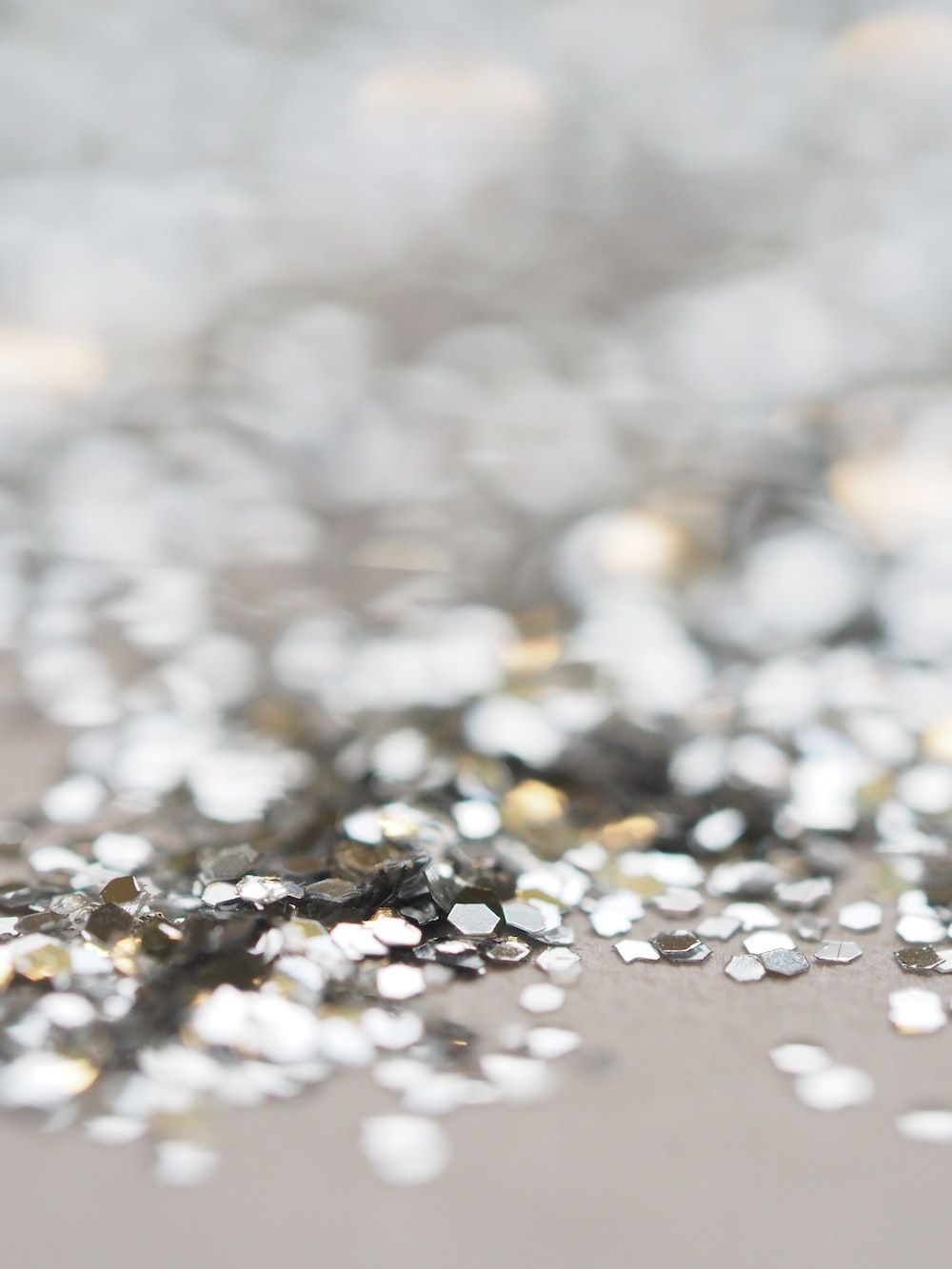 A pile of silver and gold glitter - Silver