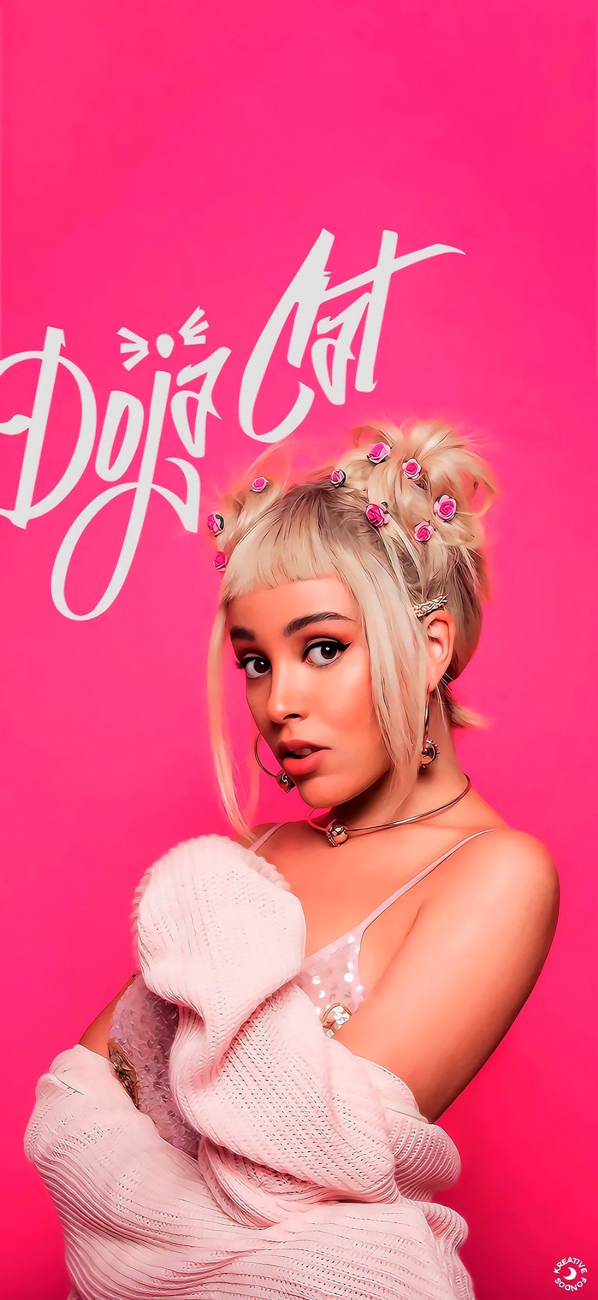 A woman in pink is posing for the camera - Doja Cat