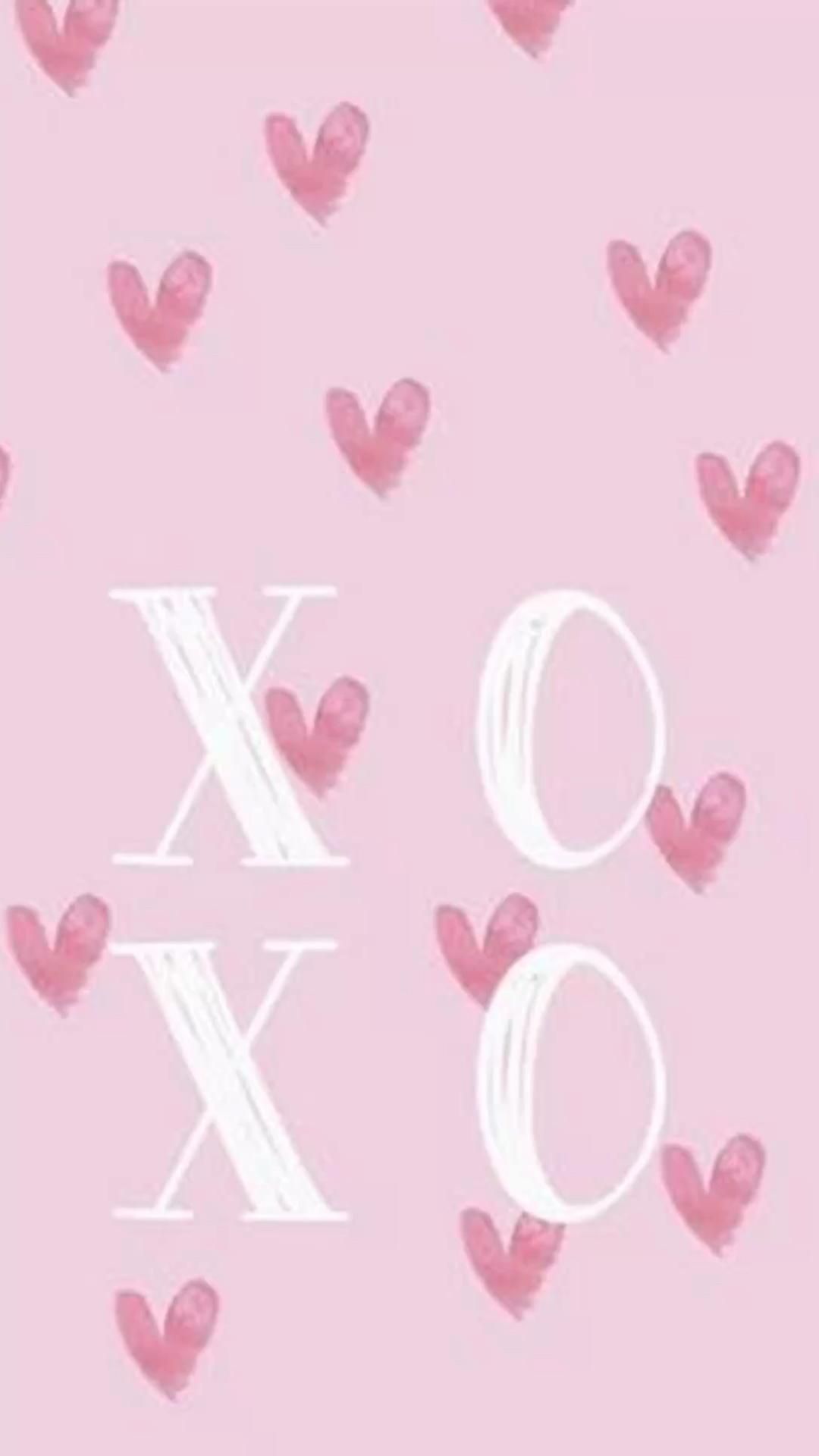 A phone wallpaper with hearts and the letters XOXO on a pink background. - Valentine's Day