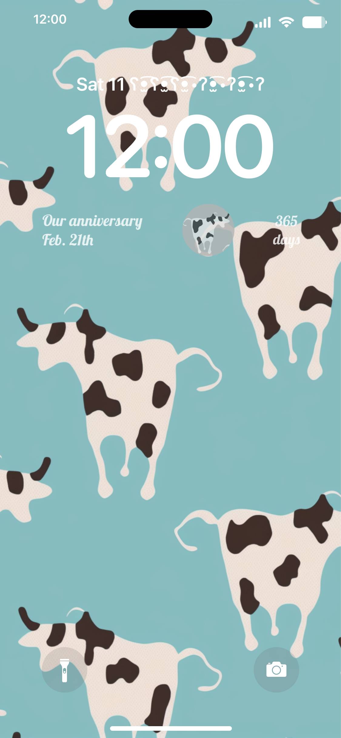 A phone screen with cows on it - Cow