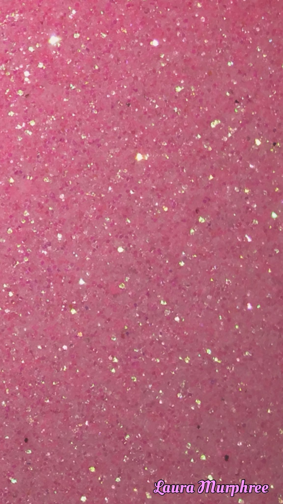 A close up of a pink surface covered in glitter. - Bling