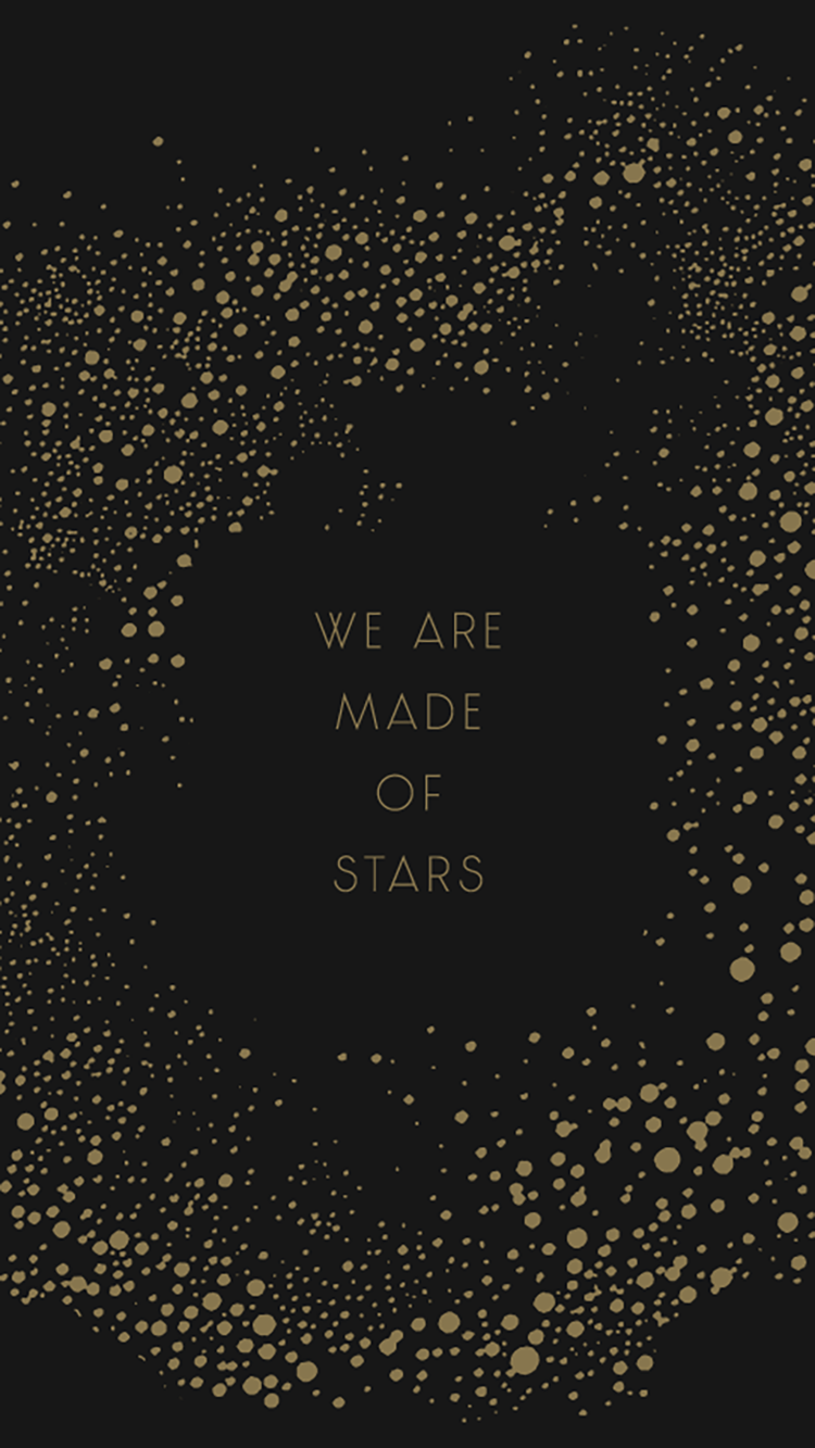 Black phone wallpaper with gold polka dots and the words 