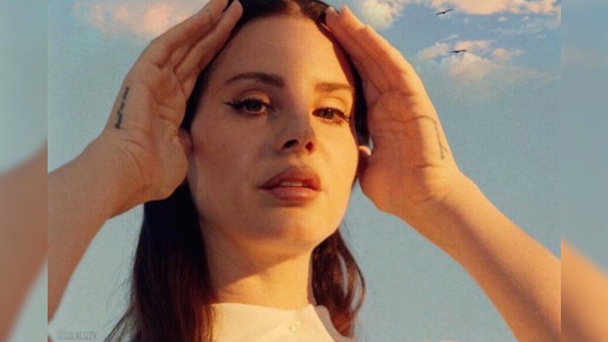 A woman with her hands on top of head - Lana Del Rey