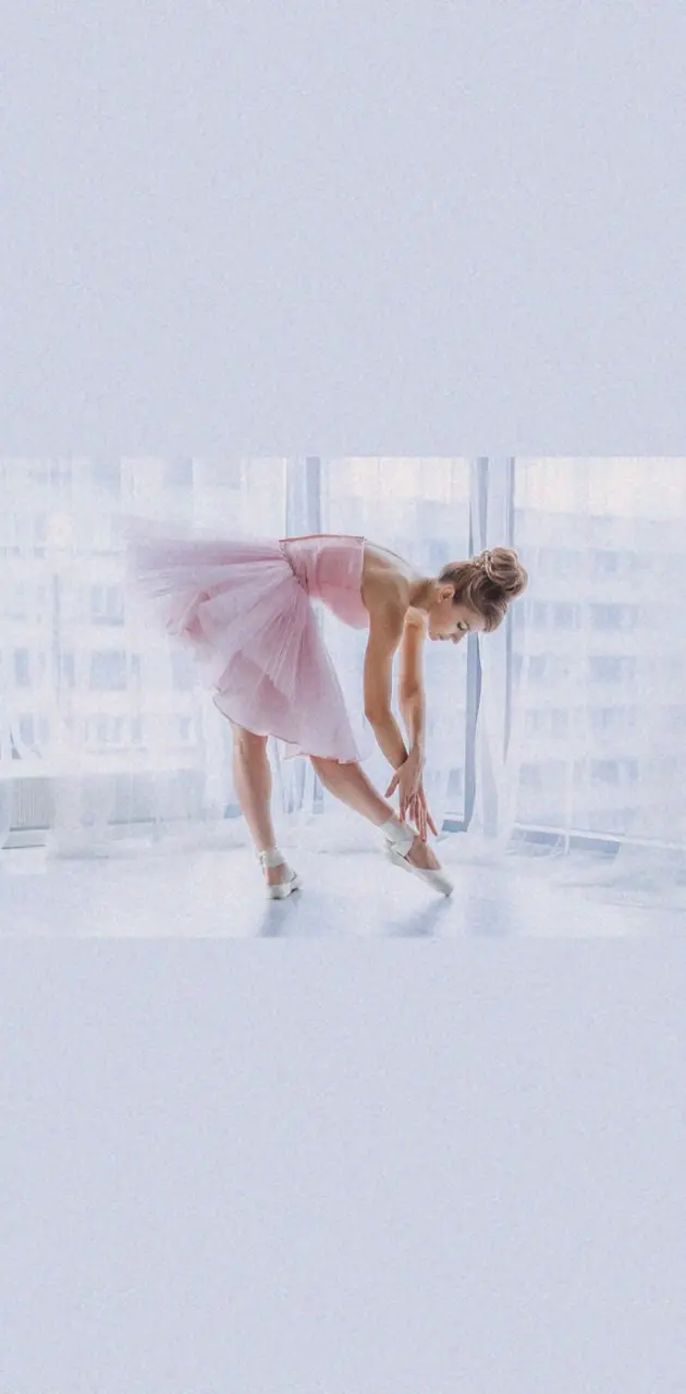A woman in pink ballet dress is doing the splits - Ballet