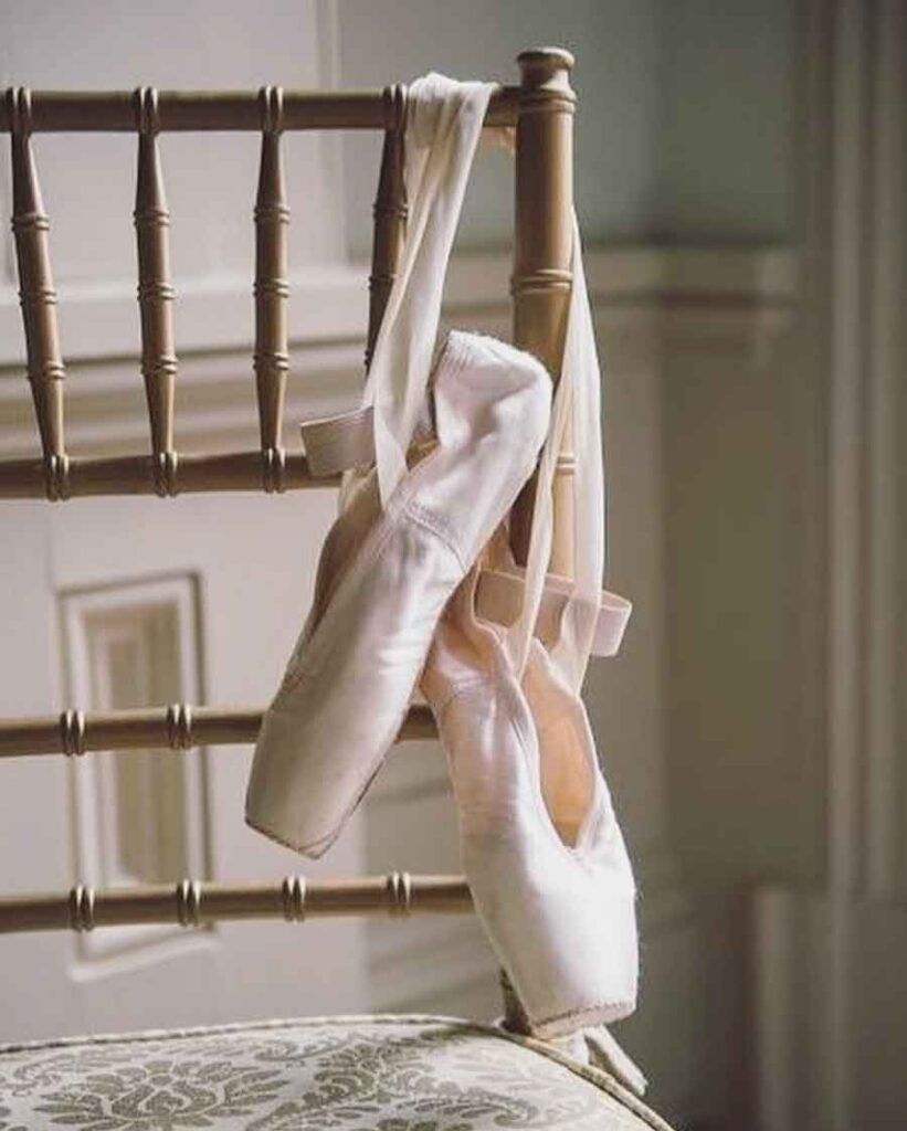 Two ballet slippers hanging on a chair - Ballet