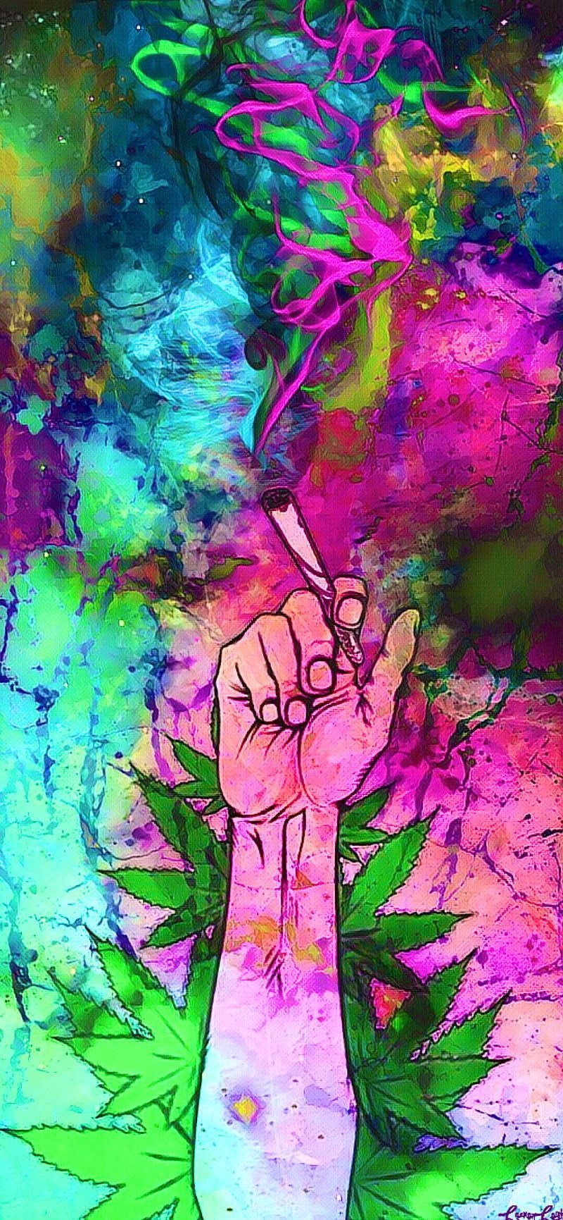 A hand holding marijuana with smoke in the background - Weed