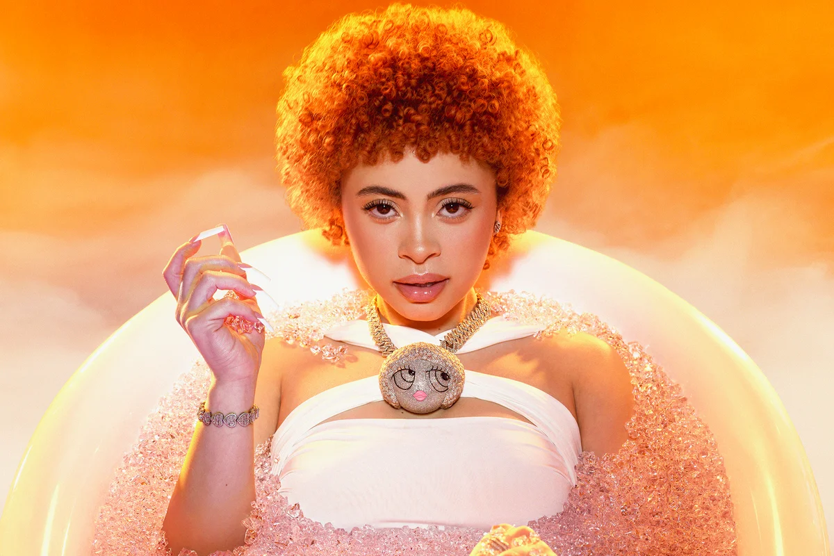 Doja Cat in a bubble bath on an orange background - Ice Spice