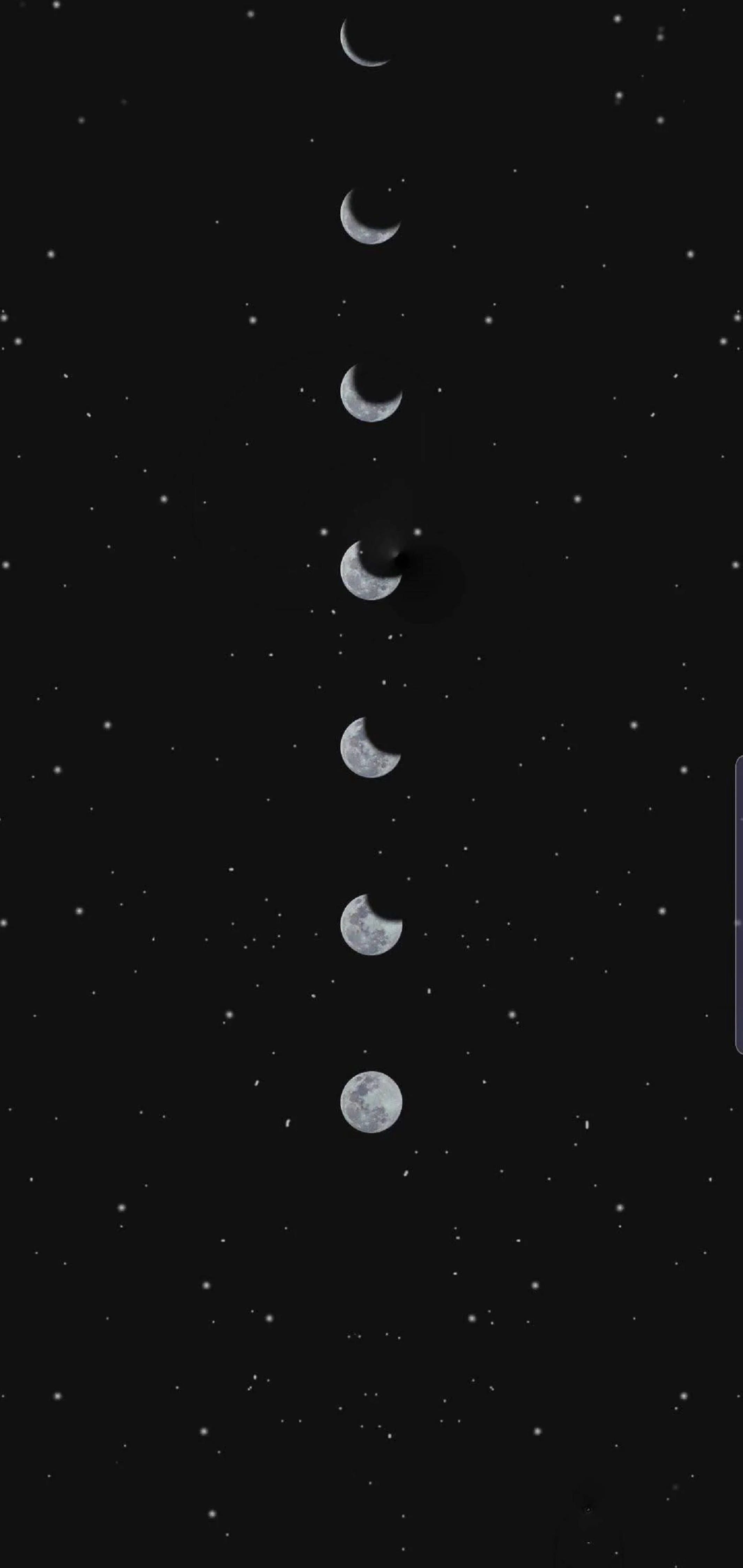 A screenshot of the game showing several planets in space - Moon phases