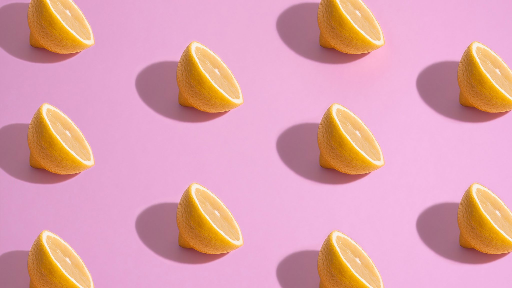 A pattern of slices on pink background - Lemon