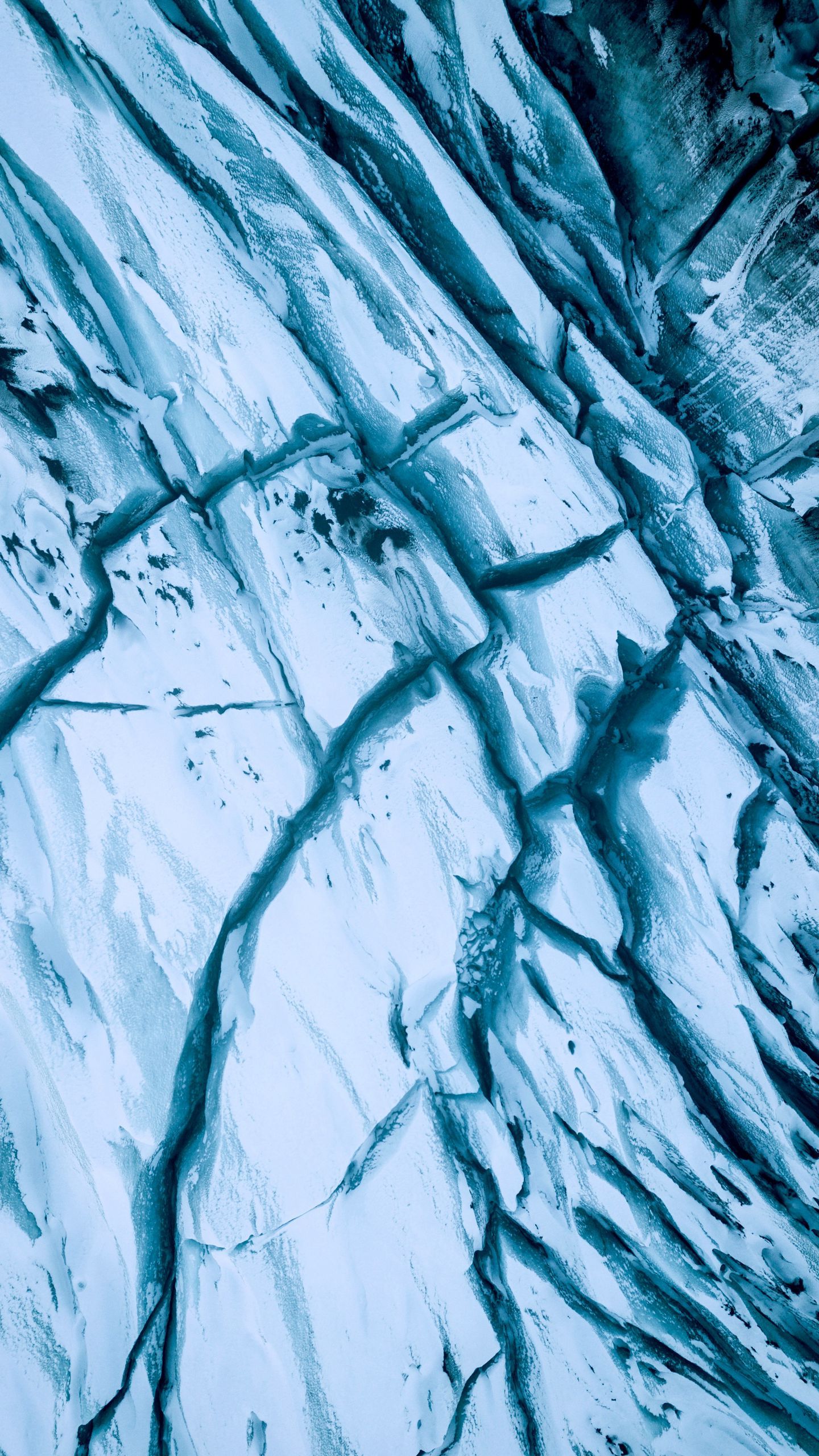 Aerial view of the blue ice formations on the glacier. - Ice