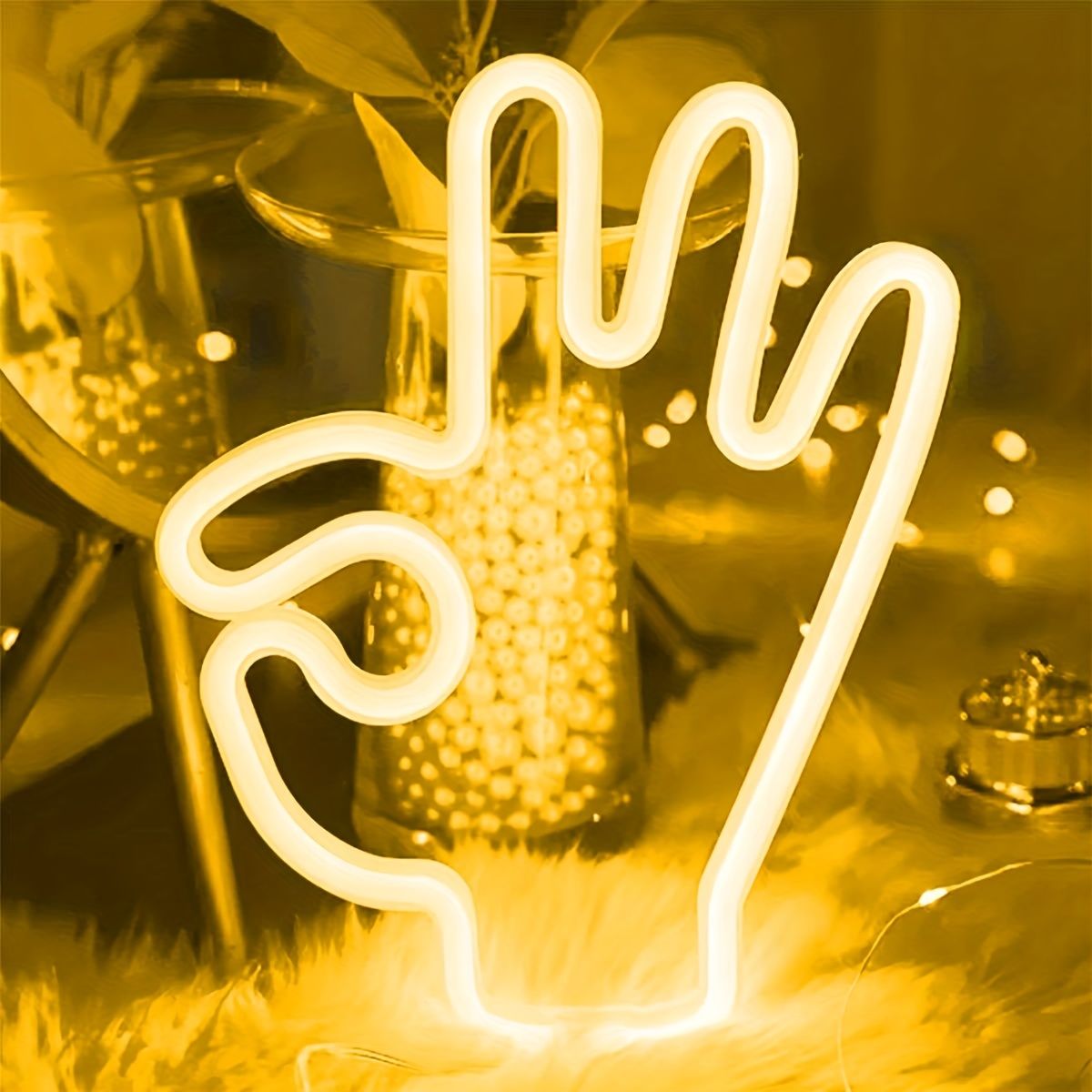 A neon sign in the shape of a hand giving the middle finger - Neon yellow