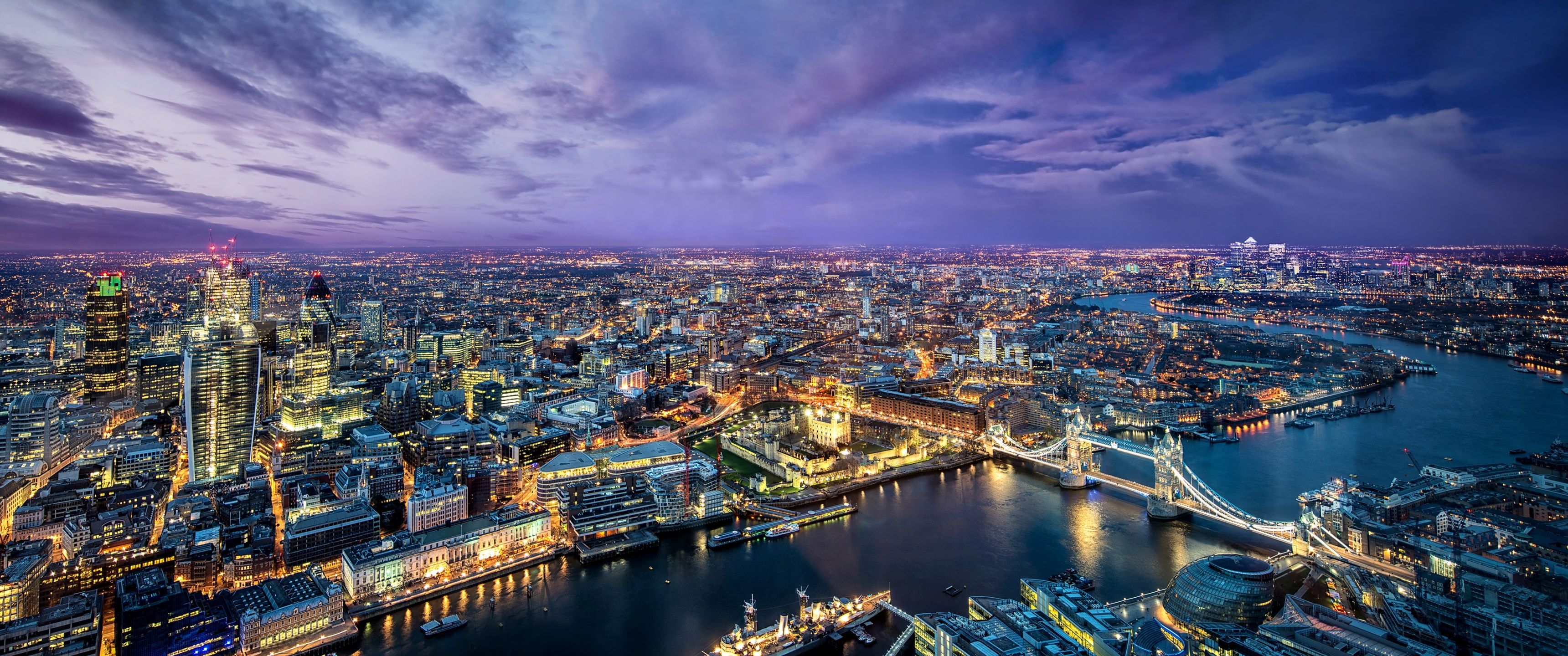 A city skyline at night with clouds - London