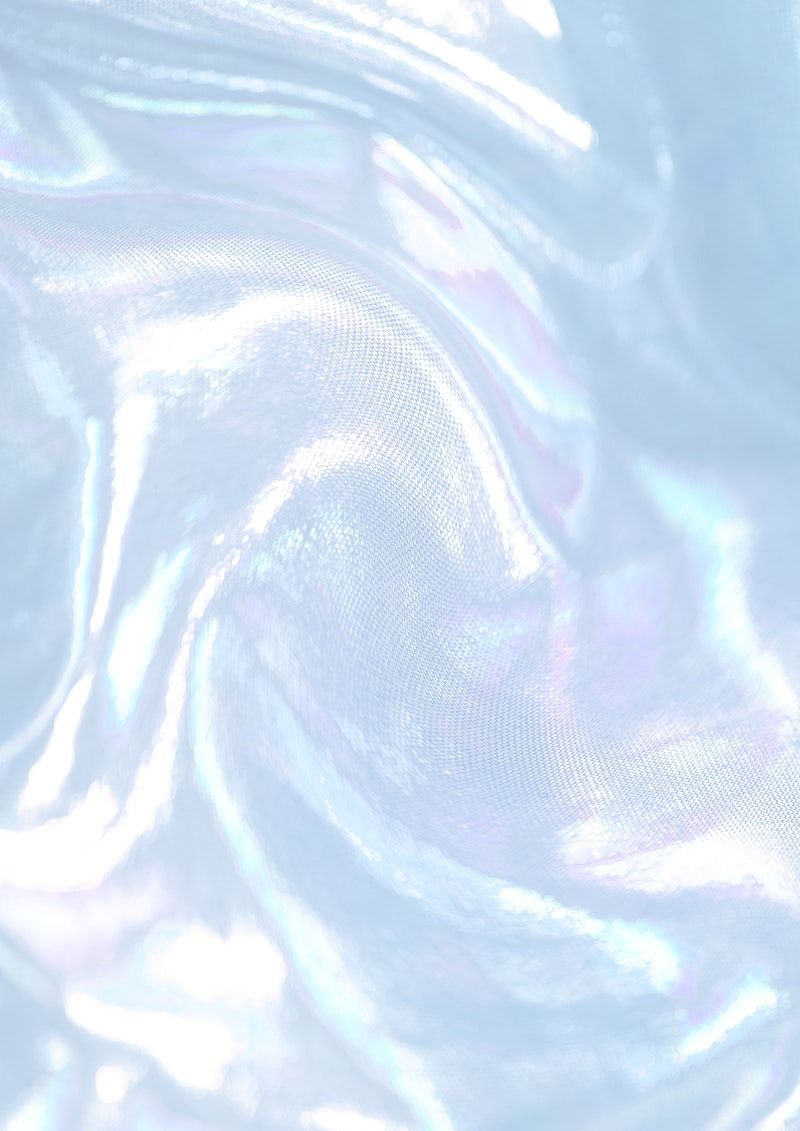 A close up of a white and blue iridescent material - Holographic