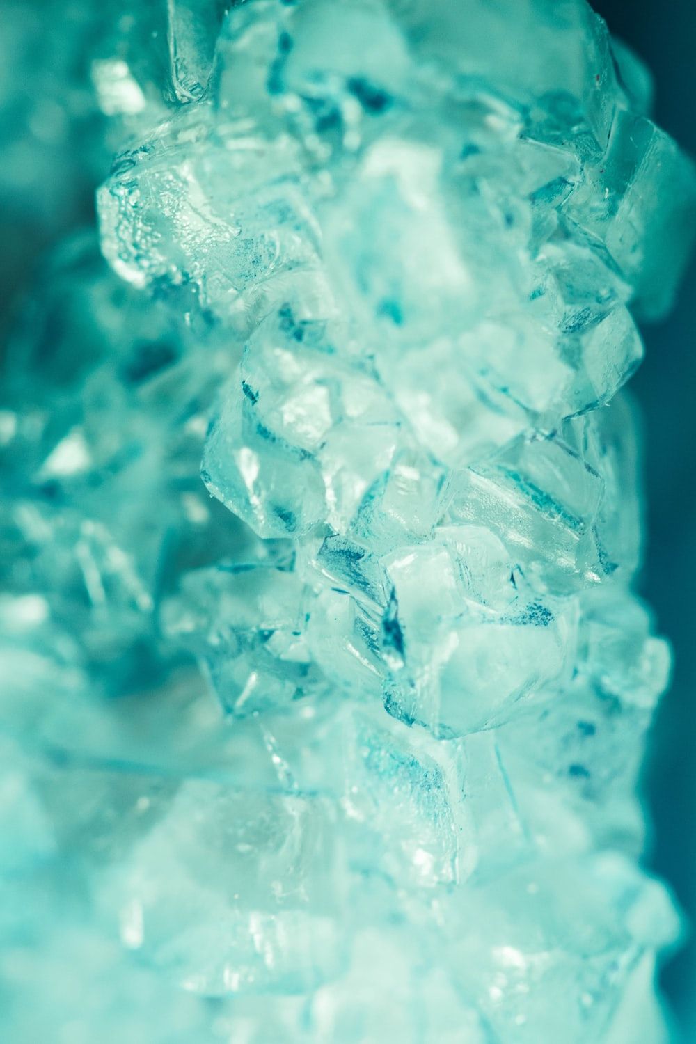 A close up of some ice in water - Teal, cyan, aqua, turquoise, ice