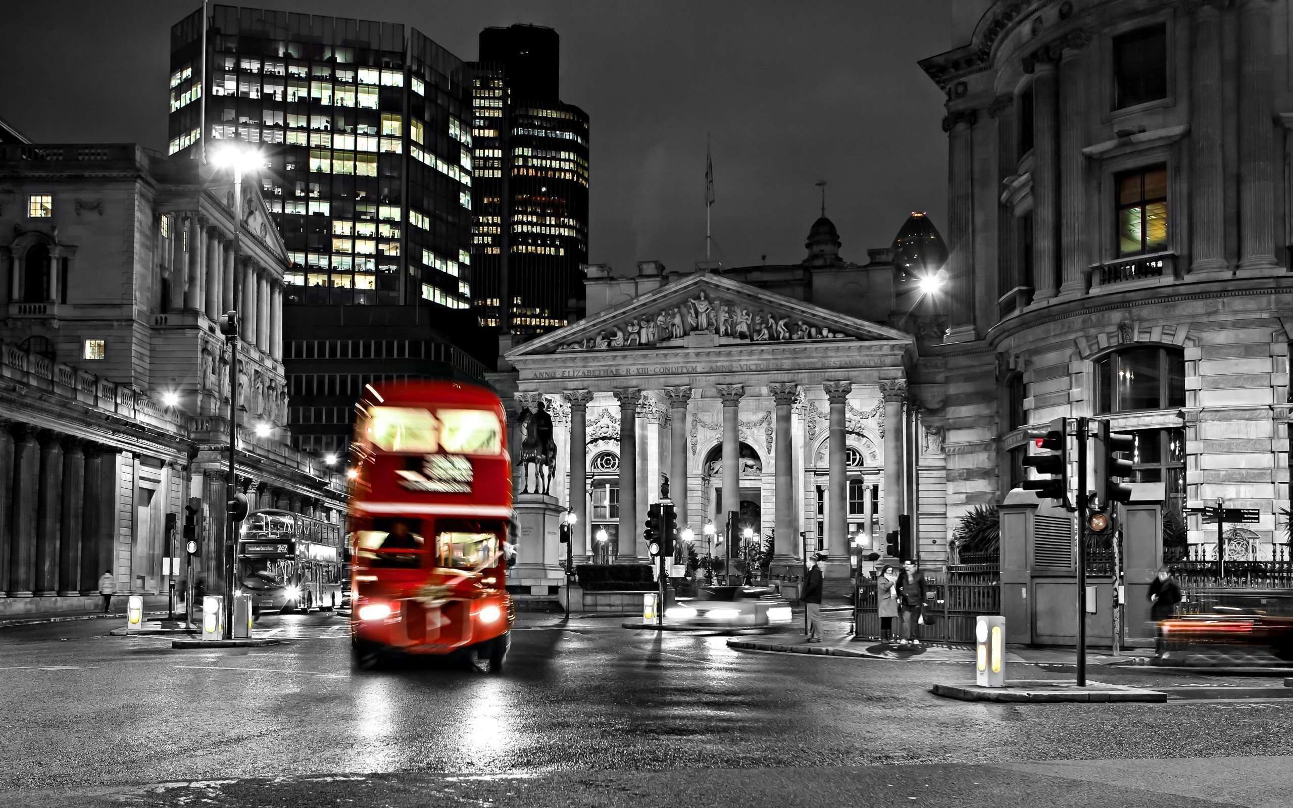 London bus in motion on a wet night in the city - London