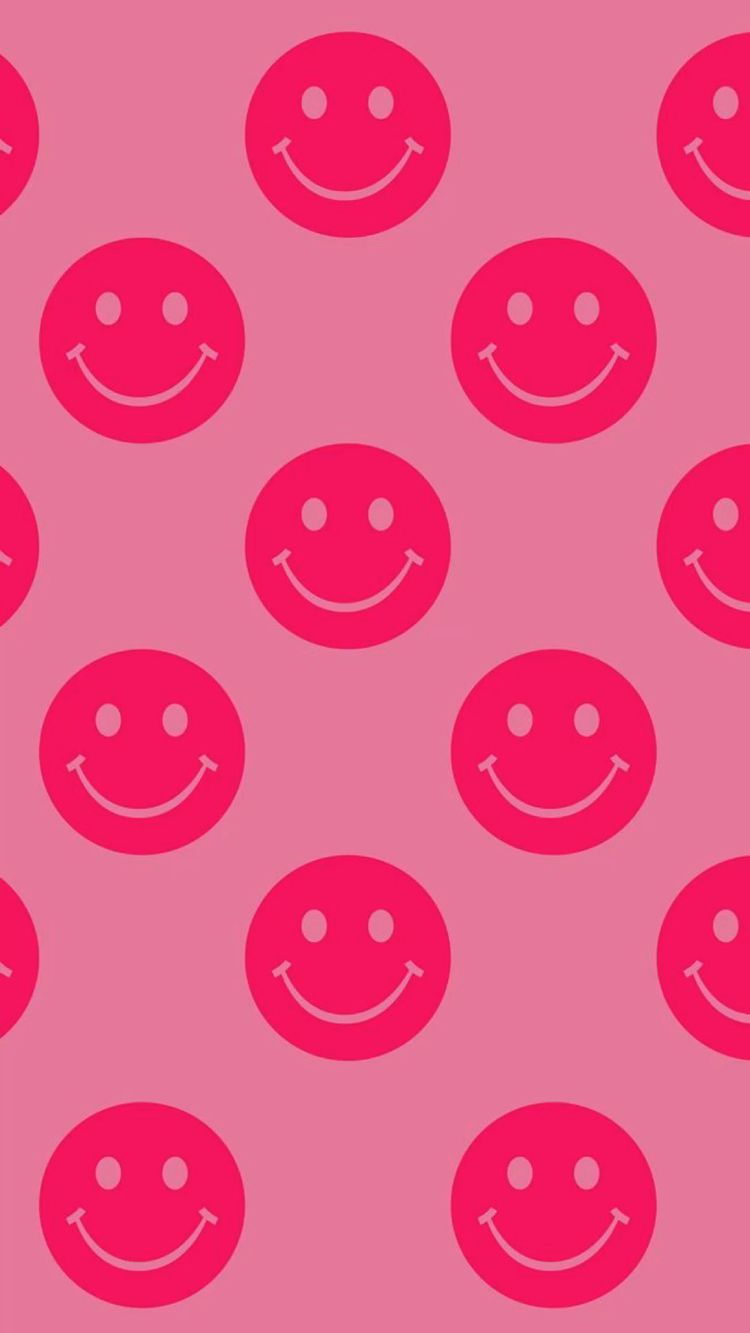A pattern of smiling faces on pink background - Smiley